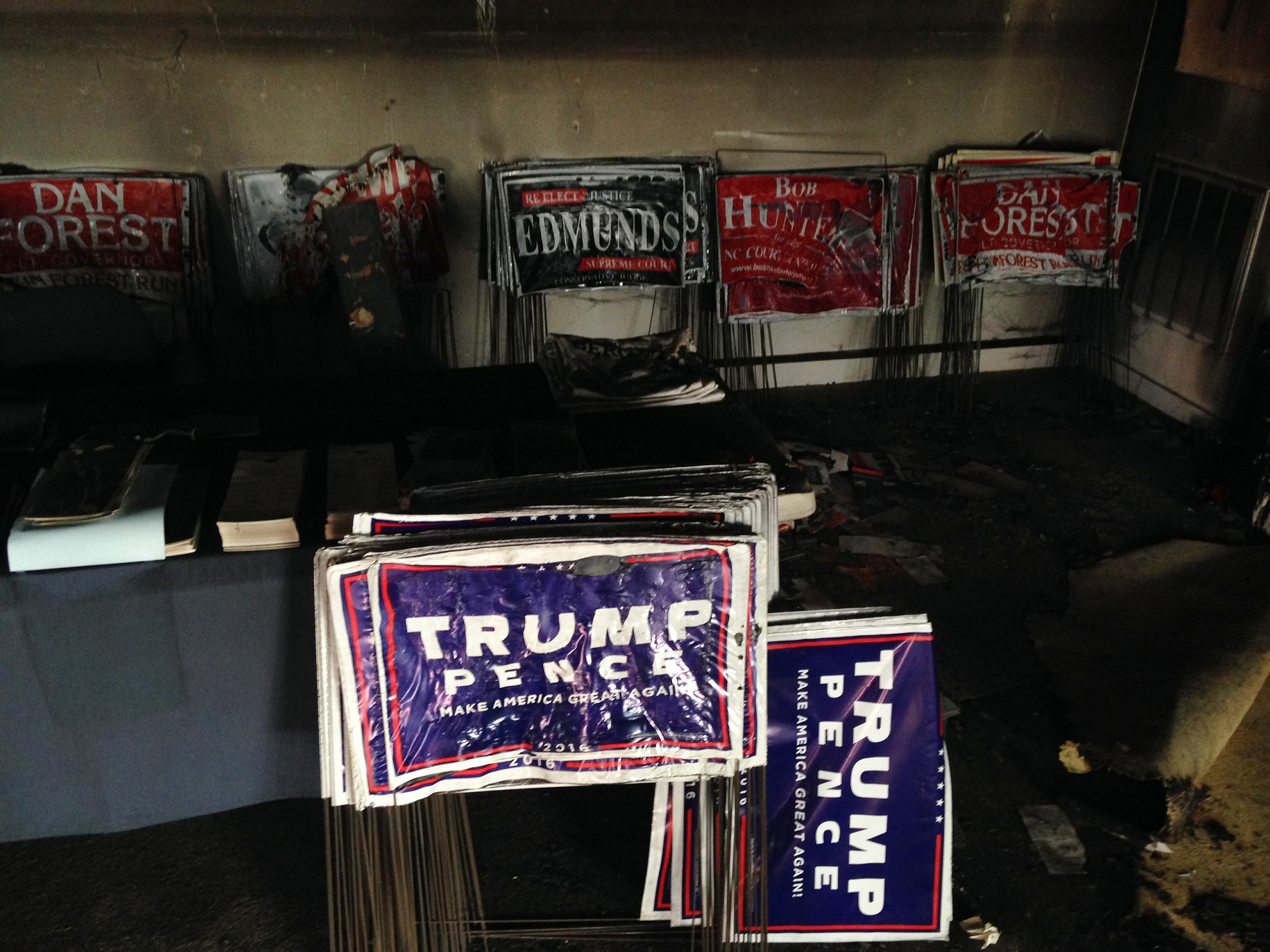 Melted campaign signs are seen at the Orange County Republican Headquarters in Hillsborough, NC., on Sunday, Oct. 16, 2016. (Jonathan Drew—AP)