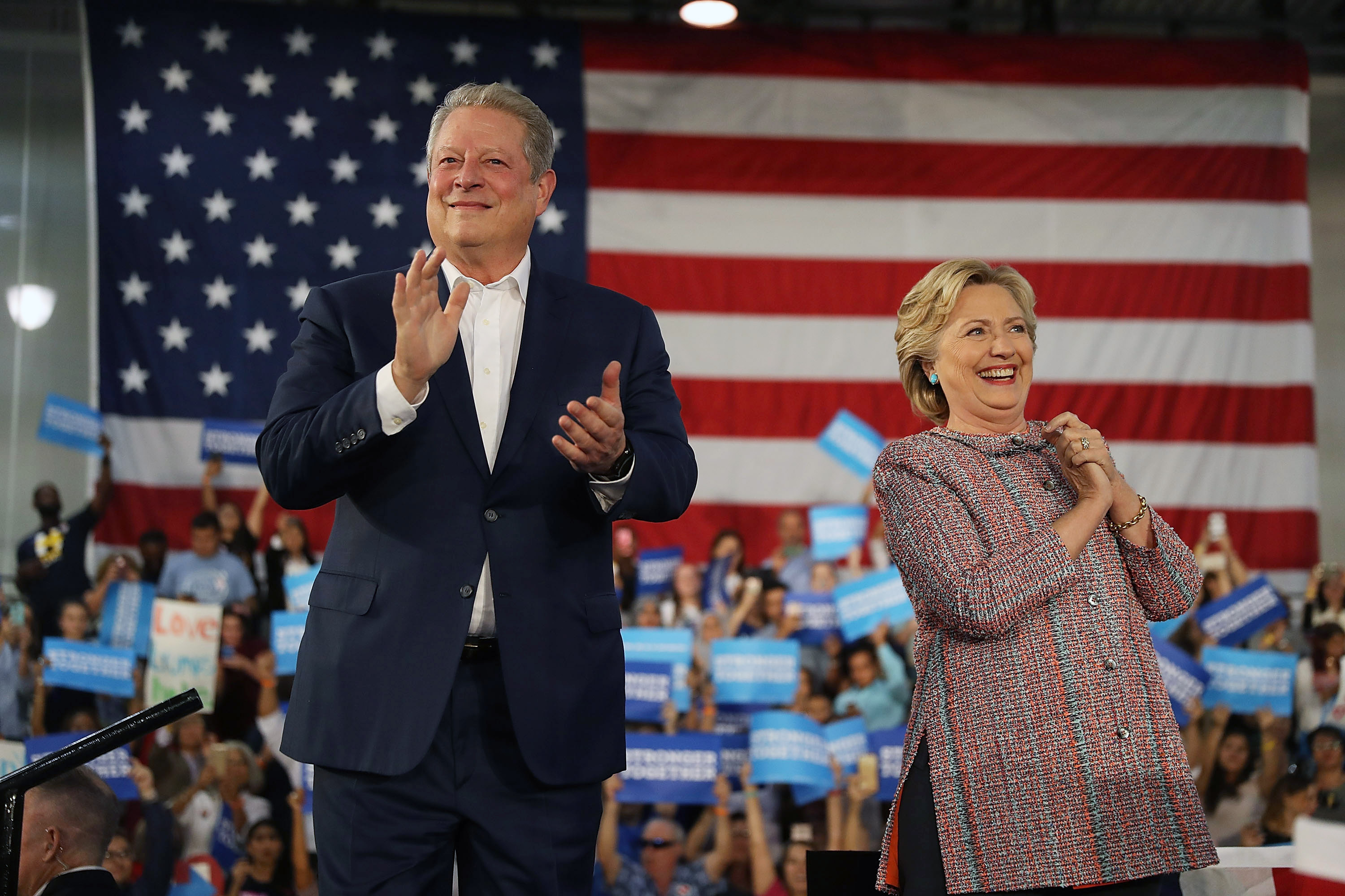 Democratic presidential nominee former Secretary of State Hillary Clinton and former Vice President Al Gore campaign together at the Miami Dade College on Oct. 11. in Miami. (Joe Raedle—Getty Images)