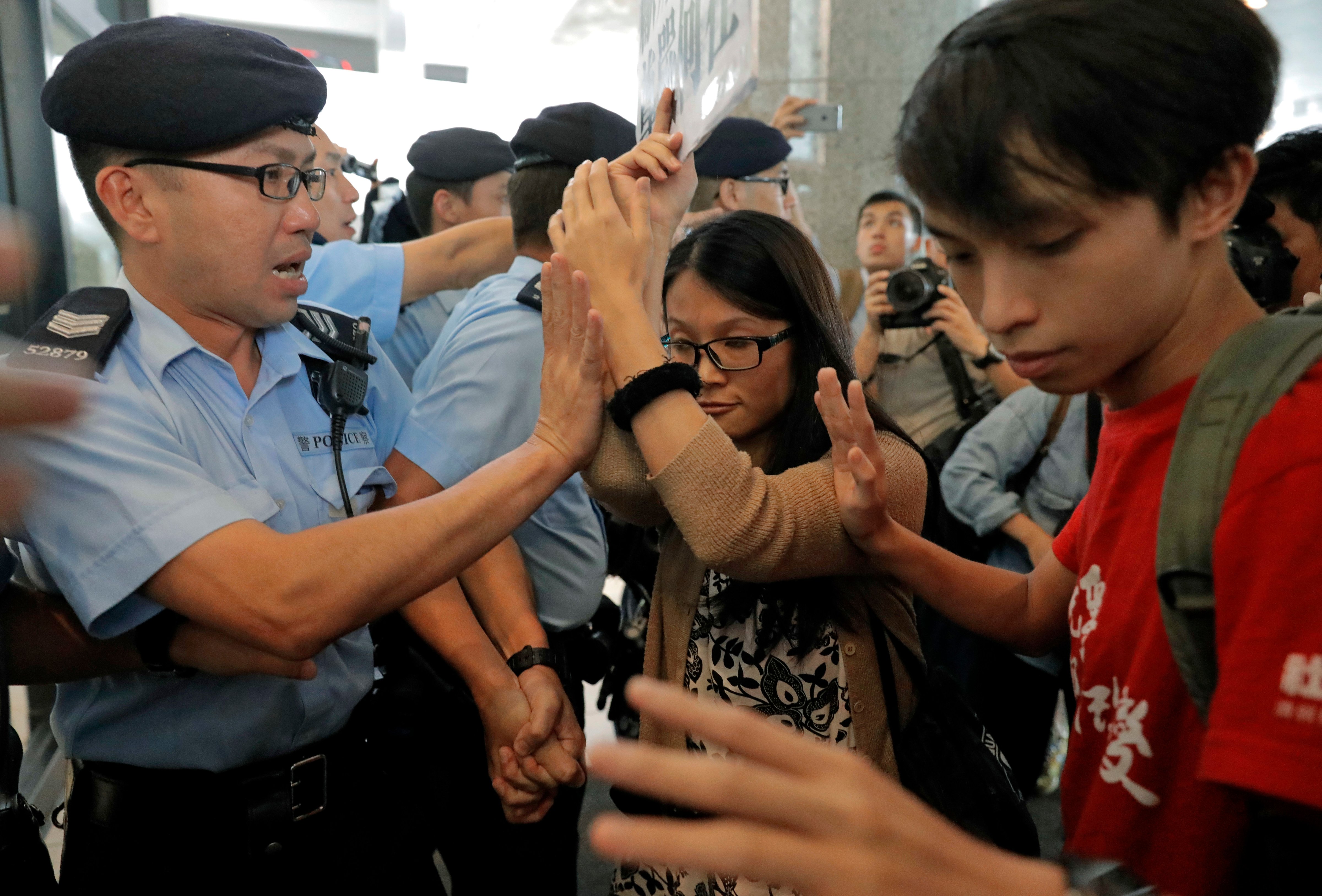 Protesters scuffle with police officers as they protest at the Thai consulate in Hong Kong on Oct. 5, 2016, after Thailand stopped teen pro-democracy activist Joshua Wong from entering the country (Vincent Yu—AP)