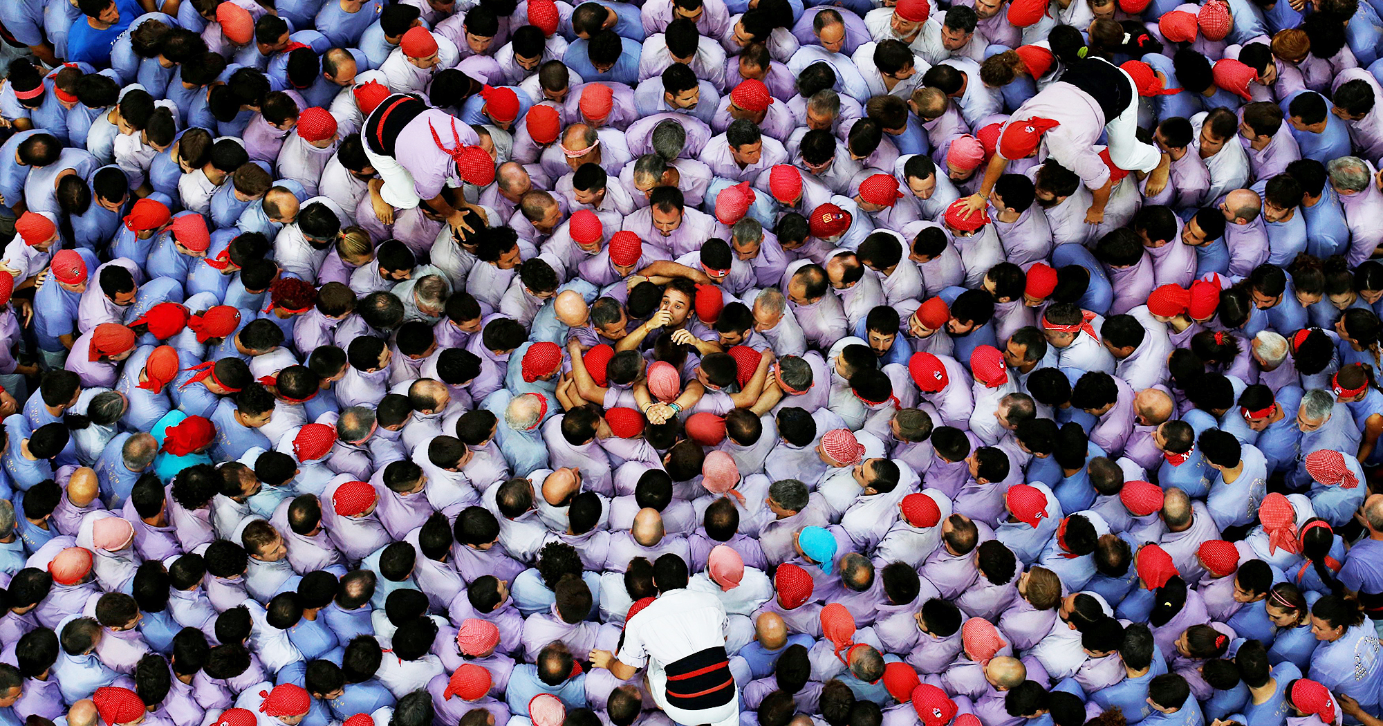 Colla Jove Xiquets de Tarragona start to form a human tower called "castell" during a biannual competition in Tarragona