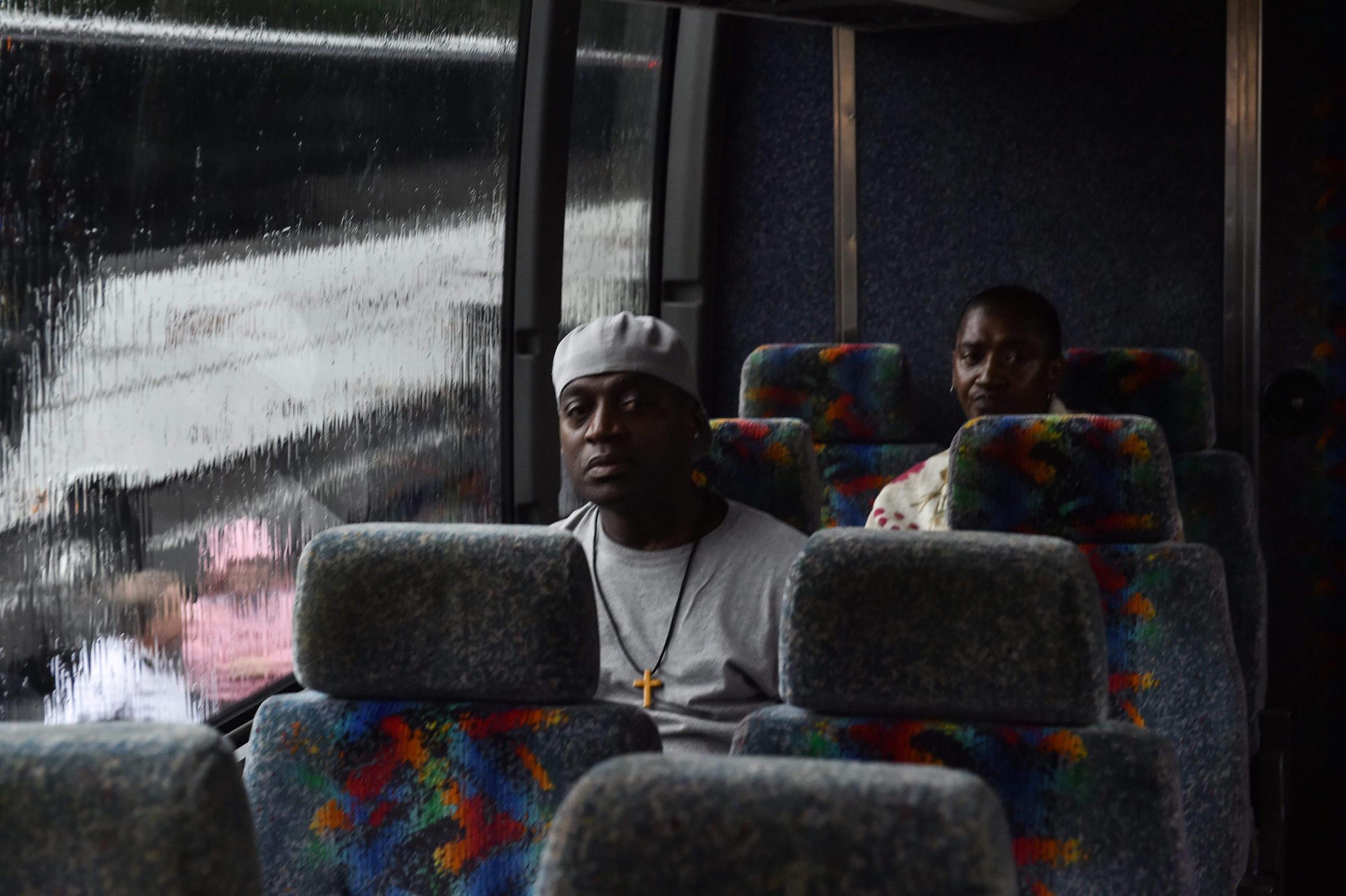 People sit on a bus in Savannah, Georgia, to be evacuated to Augusta, some 130 miles (208km) northwest, on Oct. 7, 2016.