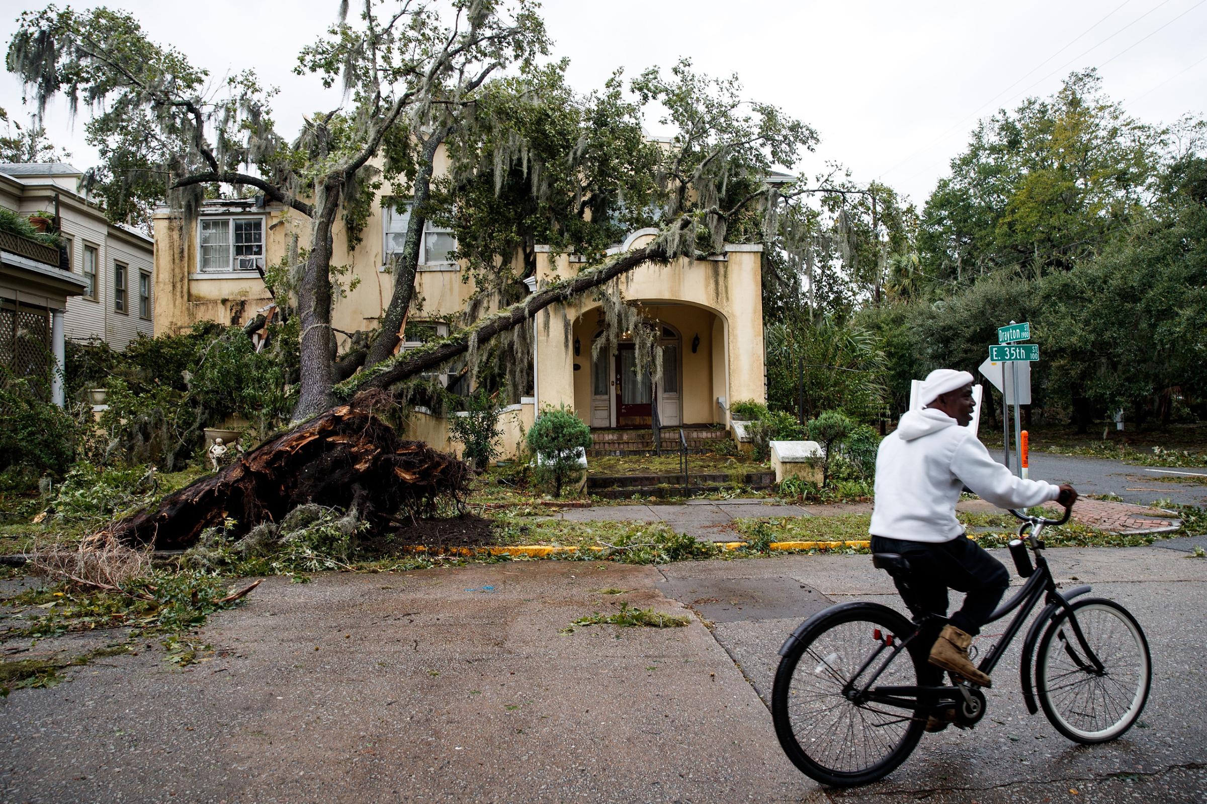 SAVANNAH, GA - OCTOBER 8: A downed tree from Hurricane Matthew rests against a home, October 8, 2016 in Savannah, Georgia. Across the Southeast, Over 1.4 million people have lost power due to Hurricane Matthew which has been downgraded to a category 1 hurricane on Saturday morning. (Photo by Drew Angerer/Getty Images)