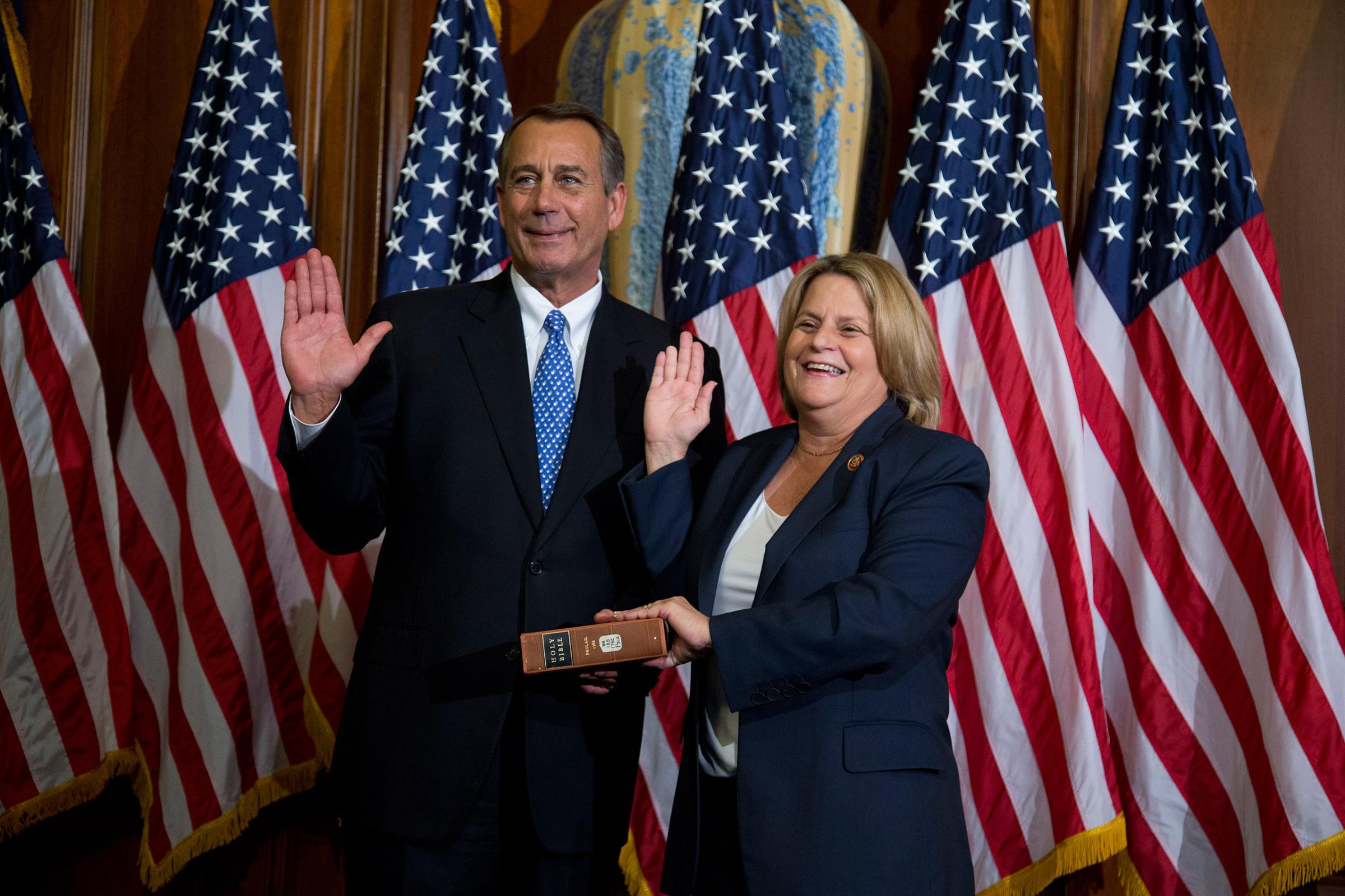 House Speaker John Boehner of Ohio performs a mock swearing in for Rep. Ileana Ros-Lehtinen, R-Fla., Thursday, Jan. 3, 2013, on Capitol Hill in Washington as the 113th Congress began.