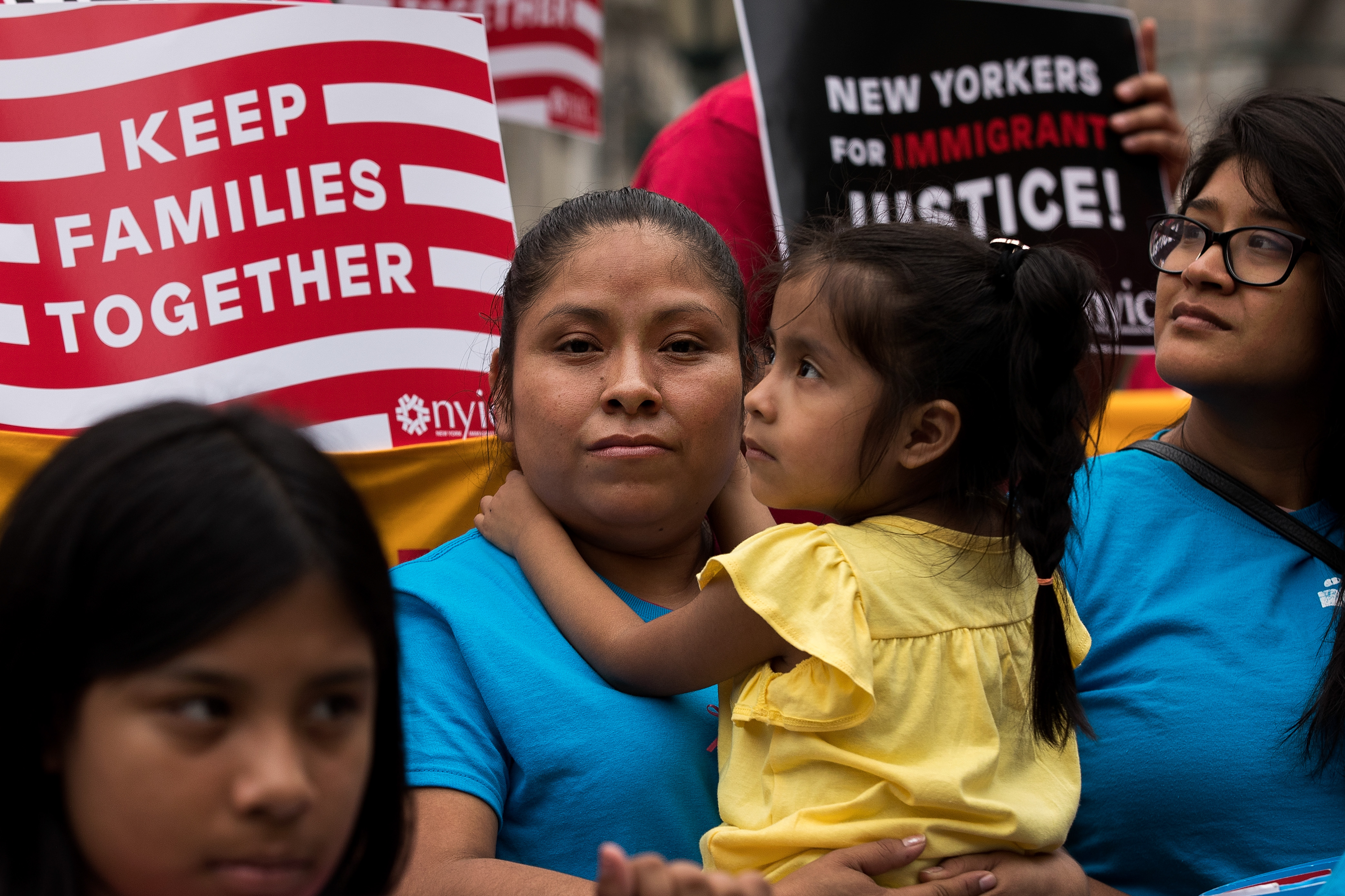 Mexican immigrant Nieves Ojendiz holds her 4-year old daughter Jane as she attends an immigration reform rally in New York City, on June 28, 2016. (Drew Angerer—Getty Images)