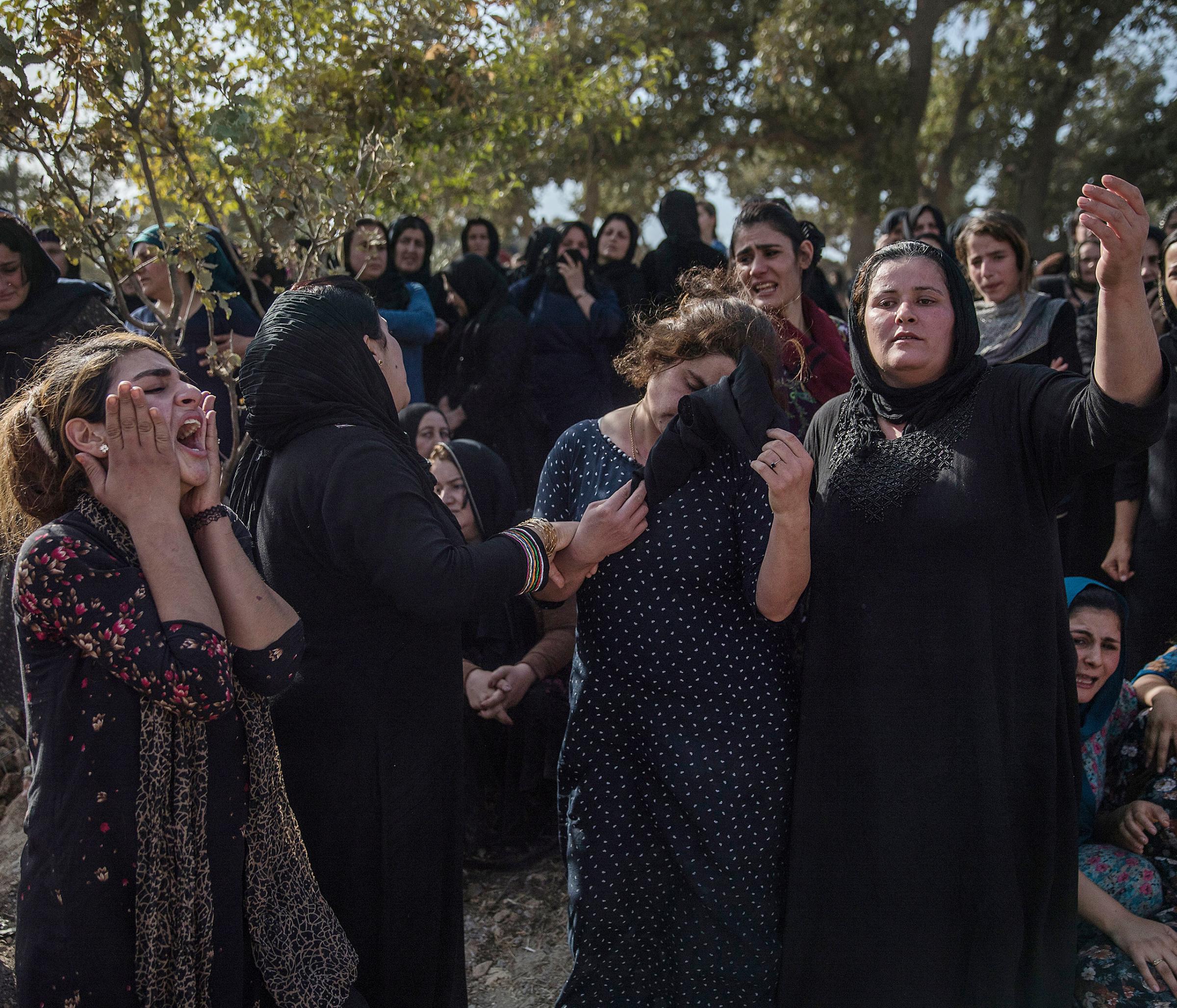 Thousands of people gather at the funeral of five Peshmerga soldiers killed by an IED explosion in their village of Khalifa, Iraq. The village has lost nearly 300 soldiers in the war against ISIS, Oct. 2016.