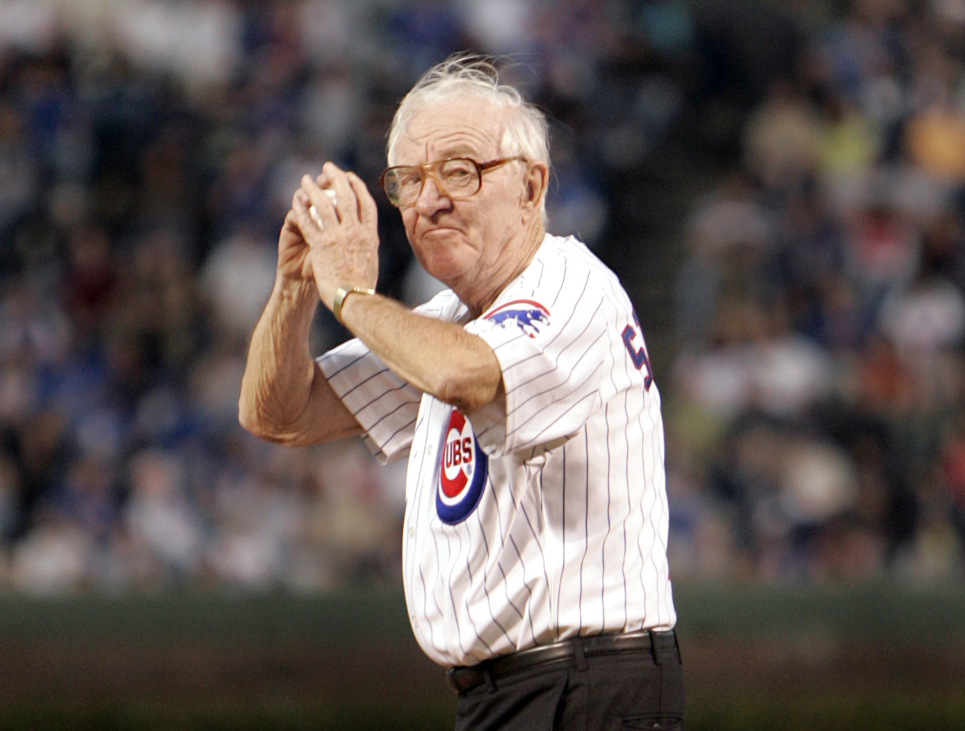 John Paul Stevens winds up to throw out the first pitch before the start of the Chicago Cubs game with the Cincinnati Reds, in Chicago, on Sept. 14, 2005. (Jeff Roberson—AP)