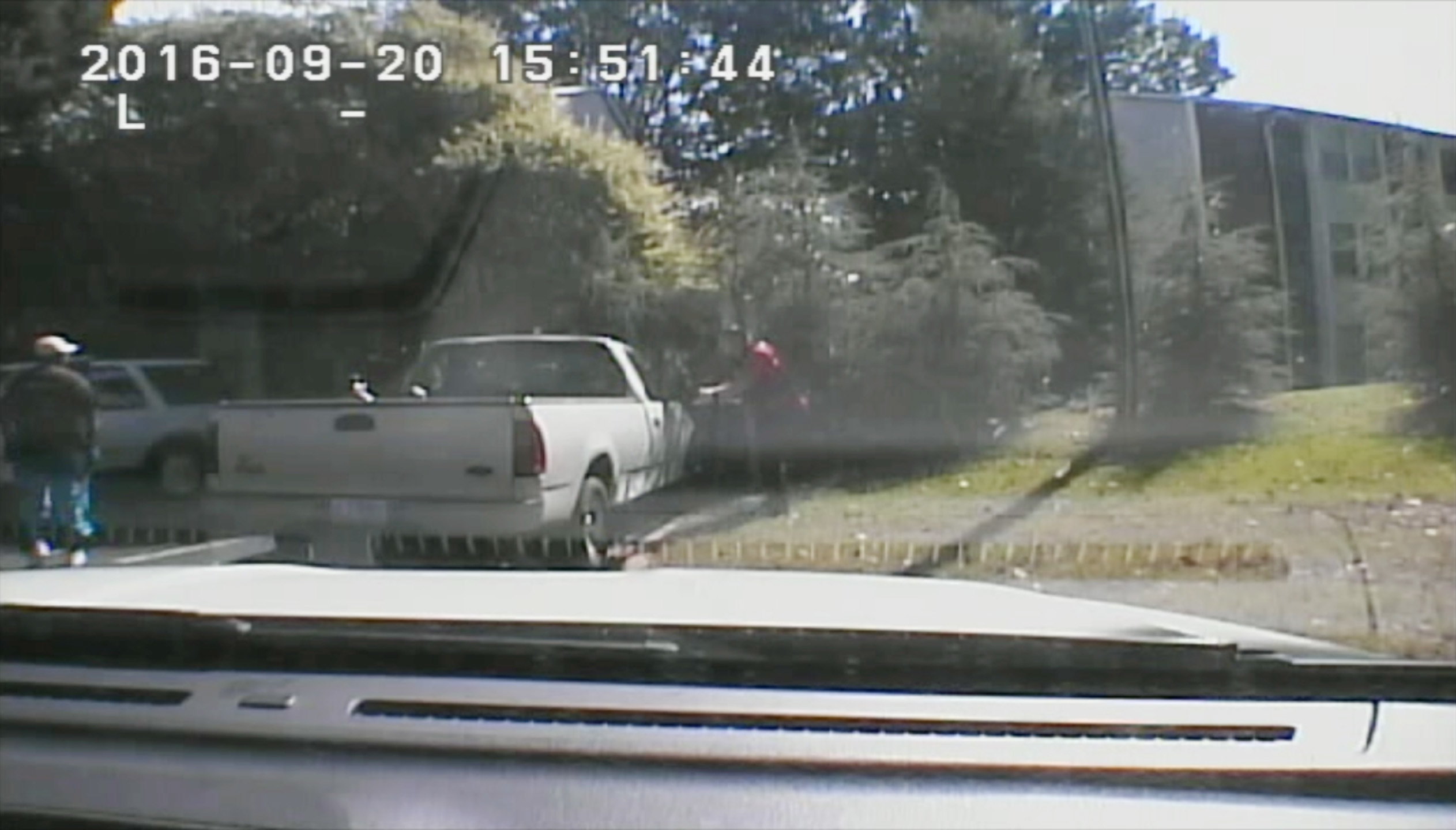 This image made from video provided by the Charlotte-Mecklenburg Police Department on Sept. 24, 2016 shows Keith Scott, left, moments before he was fatally shot by police in Charlotte, N.C., on Sept. 20, 2016. (Charlotte-Mecklenburg Police Department/AP)