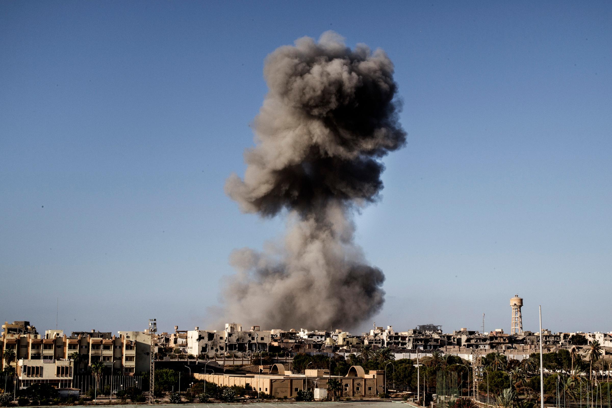Smoke rises after an airstrike on the District 3 of Sirte, the last stronghold of Islamic State (IS) on September 28, 2016.