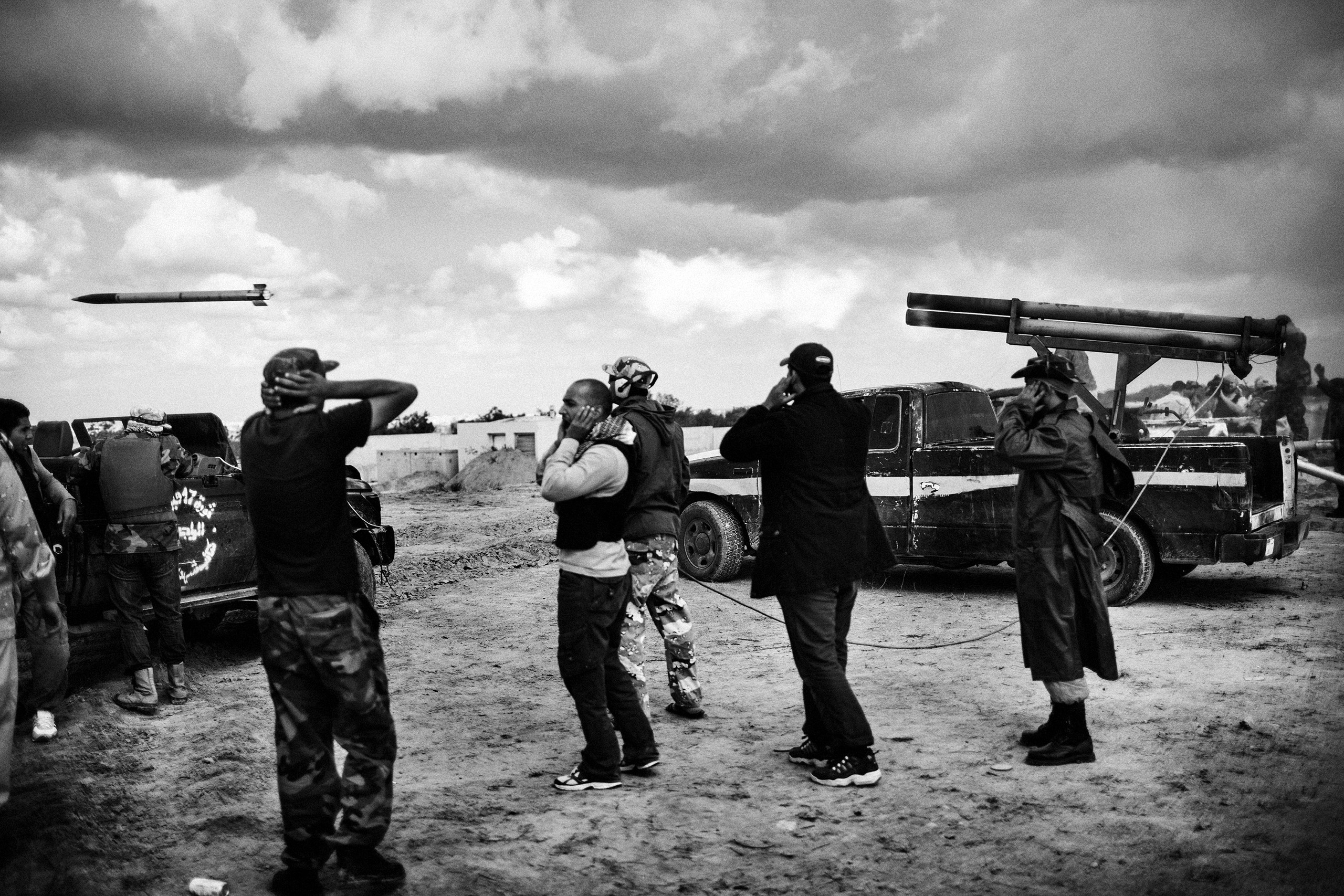 Libyan revolutionary soldiers fire katyusha rockets towards positions held by forces defending Libyan leader Muammar Gaddafi, Sirte, Oct. 11, 2011.