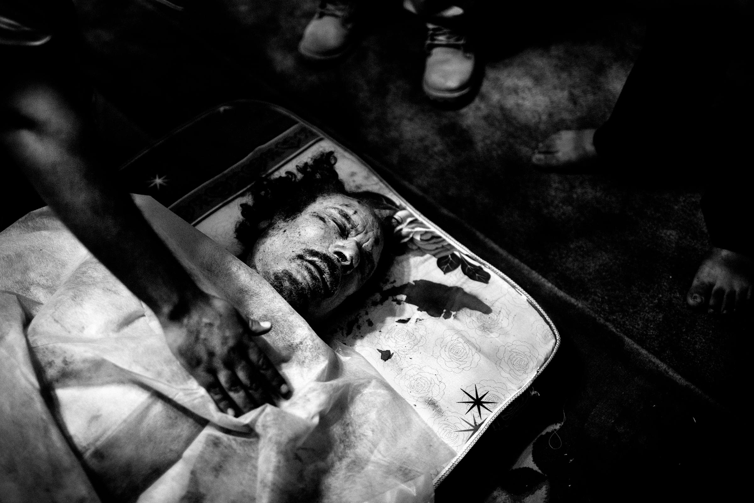 The corpse of Libyan leader Muammar Gaddafi in a rebel's home in Misurata, Libya, Oct 20, 2011, the day he was killed.