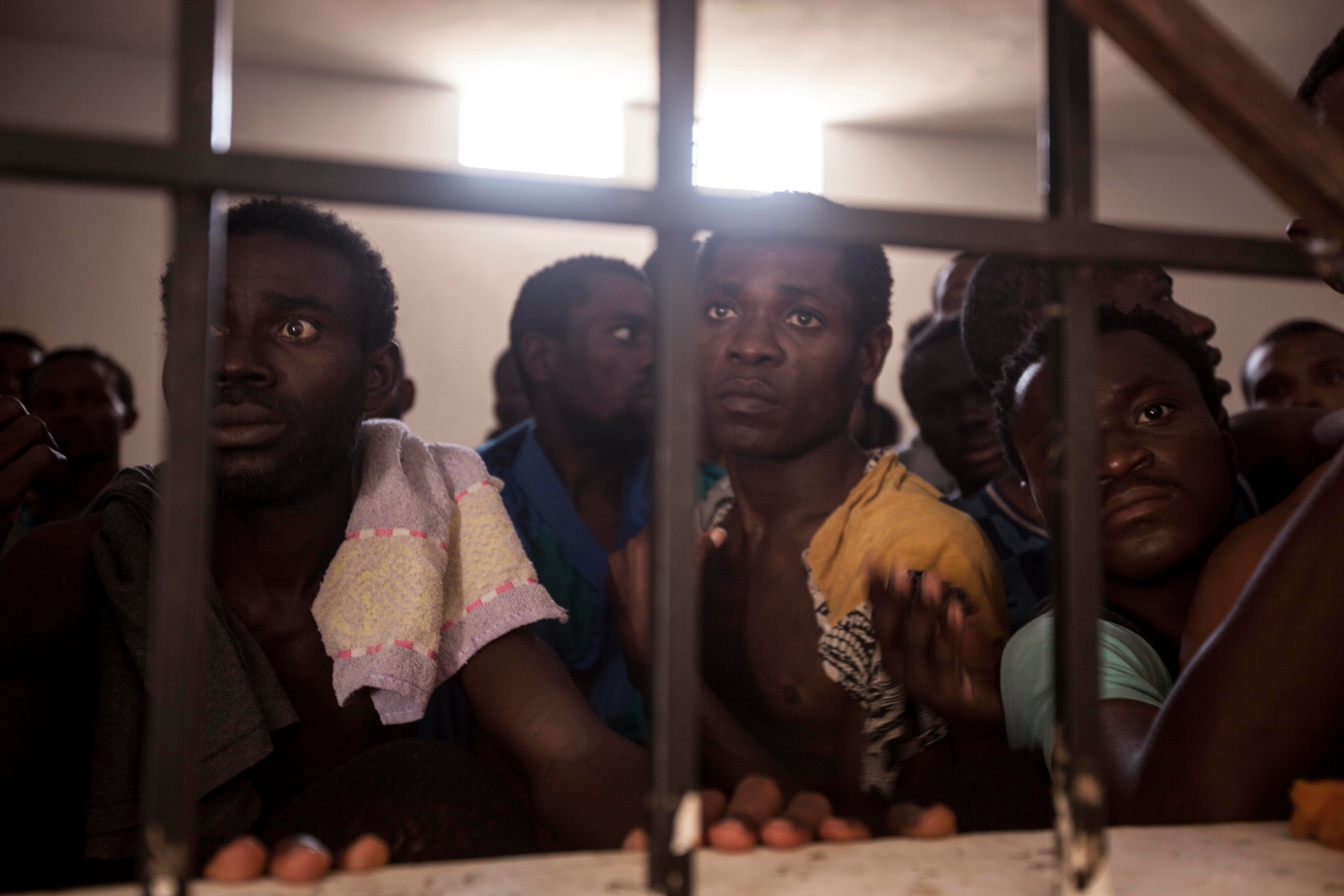 Sub-Saharan migrants and refugees begging for their release in a detention center in Surman, Libya. (Narciso Contreras for Fondation Carmignac)