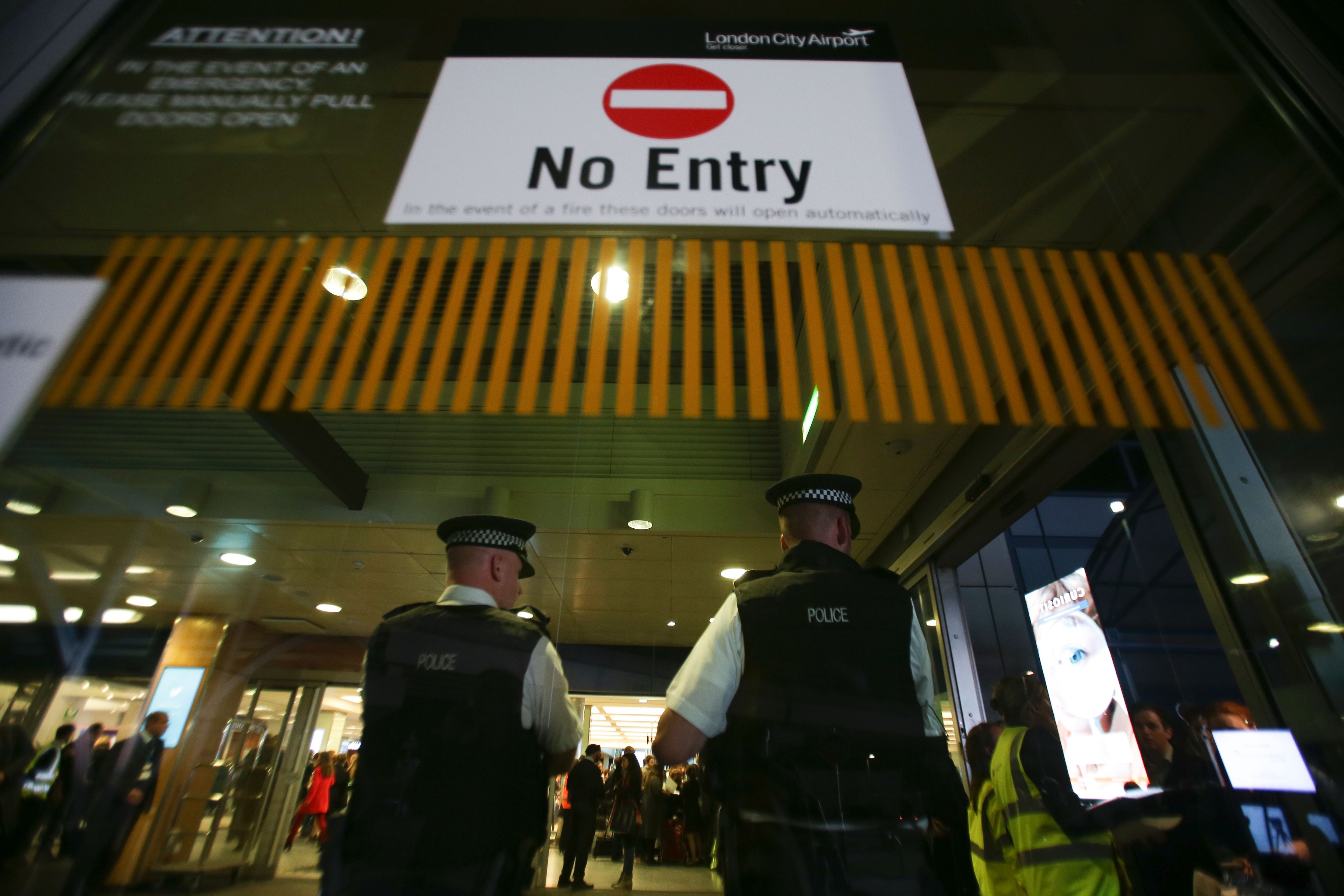Police officers secure the entrance to London's City Airport on October 21, 2016 after an evacuation. (Daniel Leal-Olivas —AFP/Getty Images)