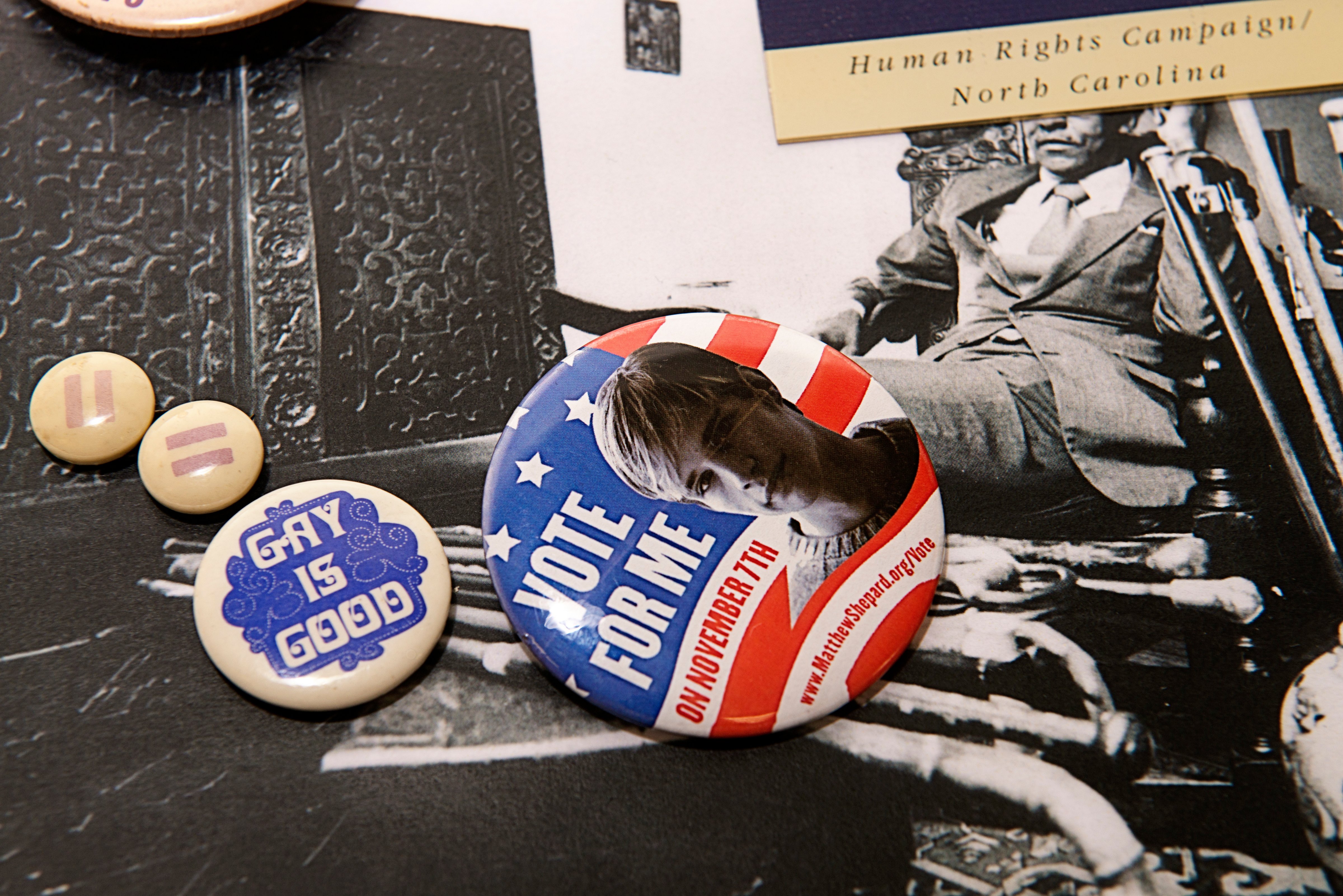 Buttons for voters who support LGBTQ rights, including one with a picture of the late Matthew Shepard, likely from the 1998 election. (Marvin Joseph—The Washington Post via Getty Images)