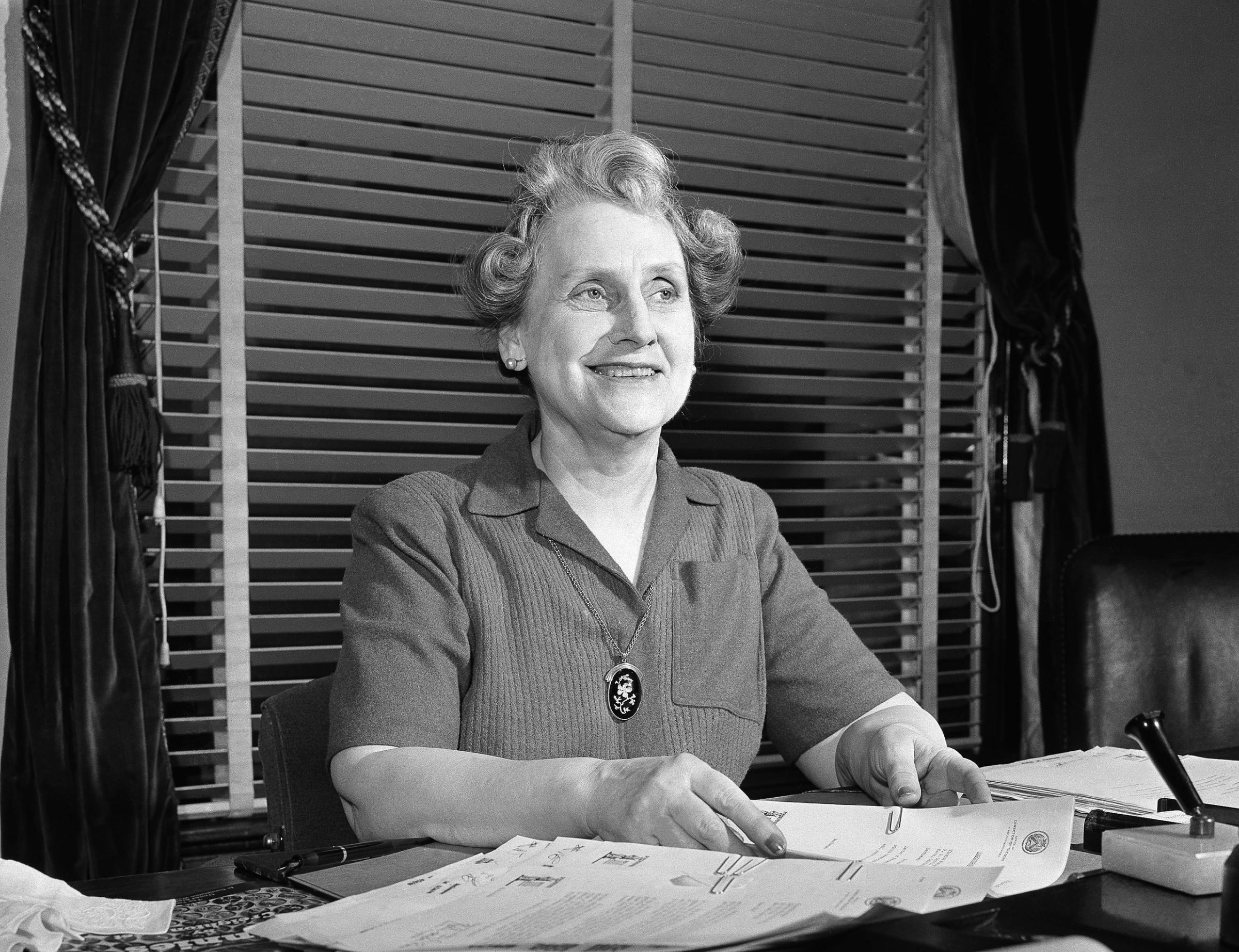 Nellie Tayloe Ross Director of the bureau of the Mint at her desk on May 1, 1942 in Washington where she supervises the turning out of the billions of coins needed for the defense effort.