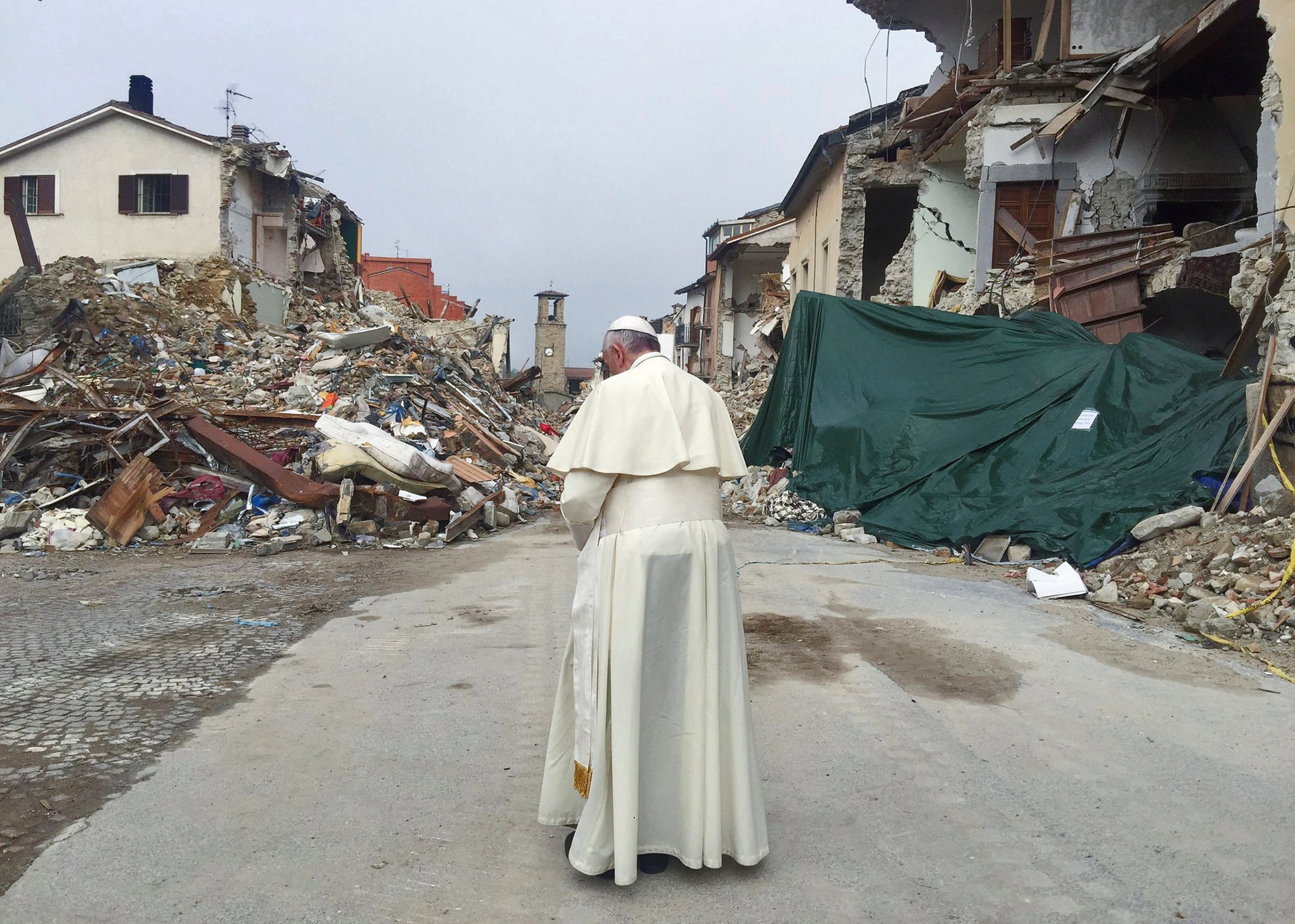 Pope Francis prays in Amatrice, Italy, on Oct. 4, 2016.