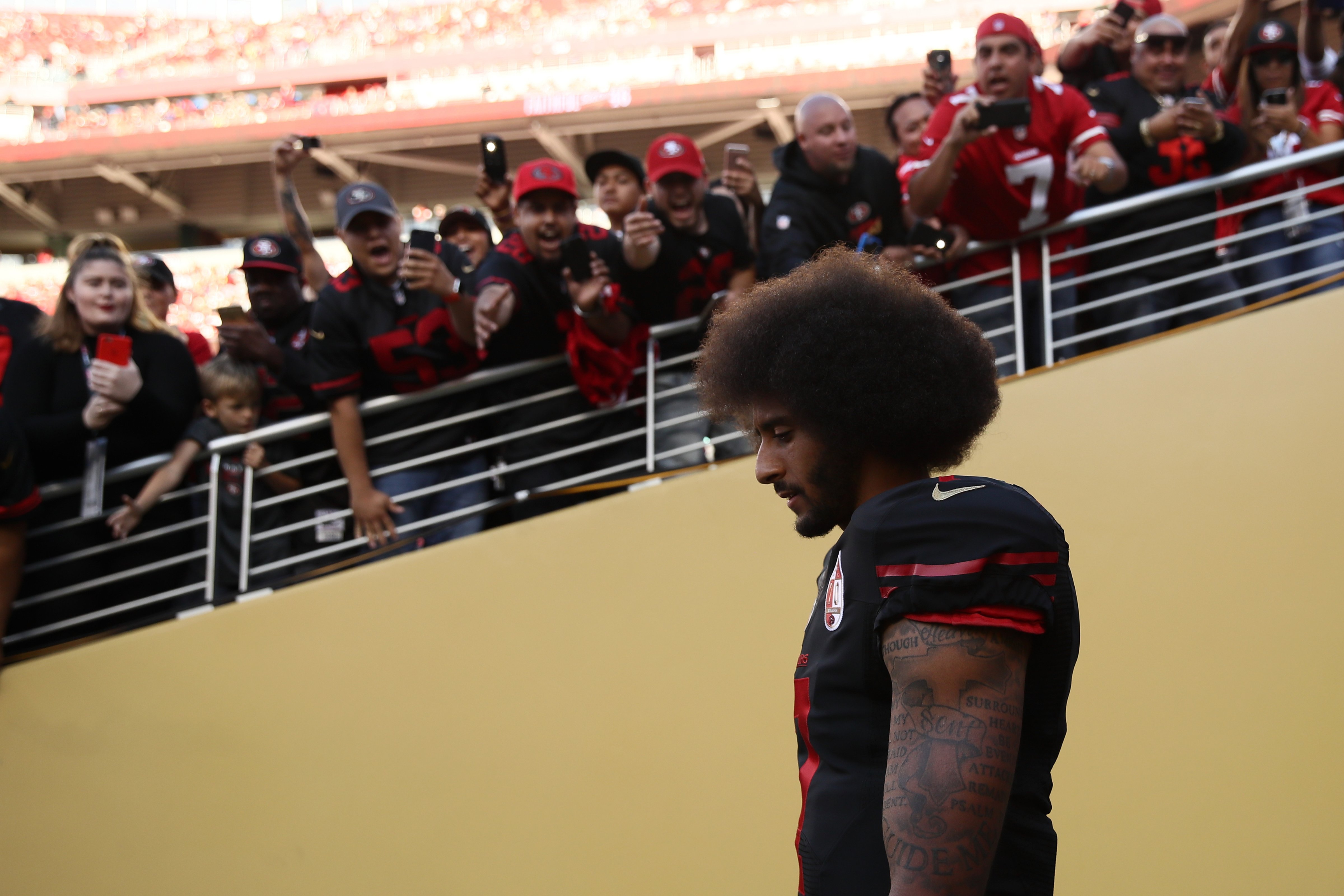 Colin Kaepernick, quarterback for the San Francisco 49ers, walks on the field prior to the team's NFL game on October 6, 2016. (Ezra Shaw&mdash;Getty Images)