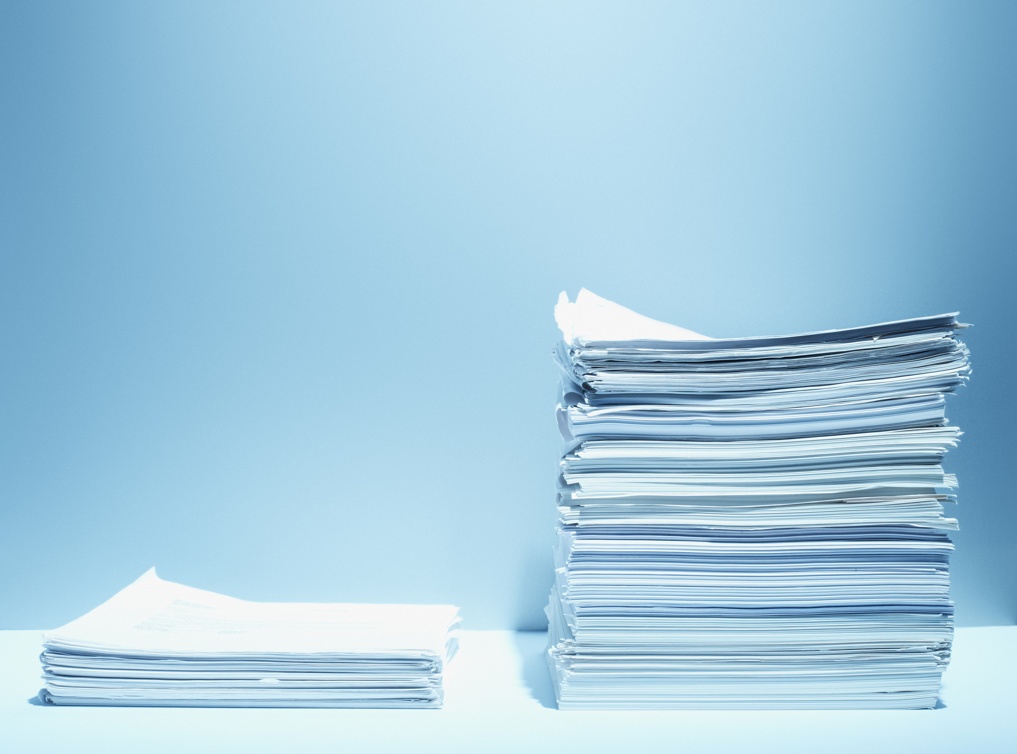 Tall and short stacks of paper (Getty Images)