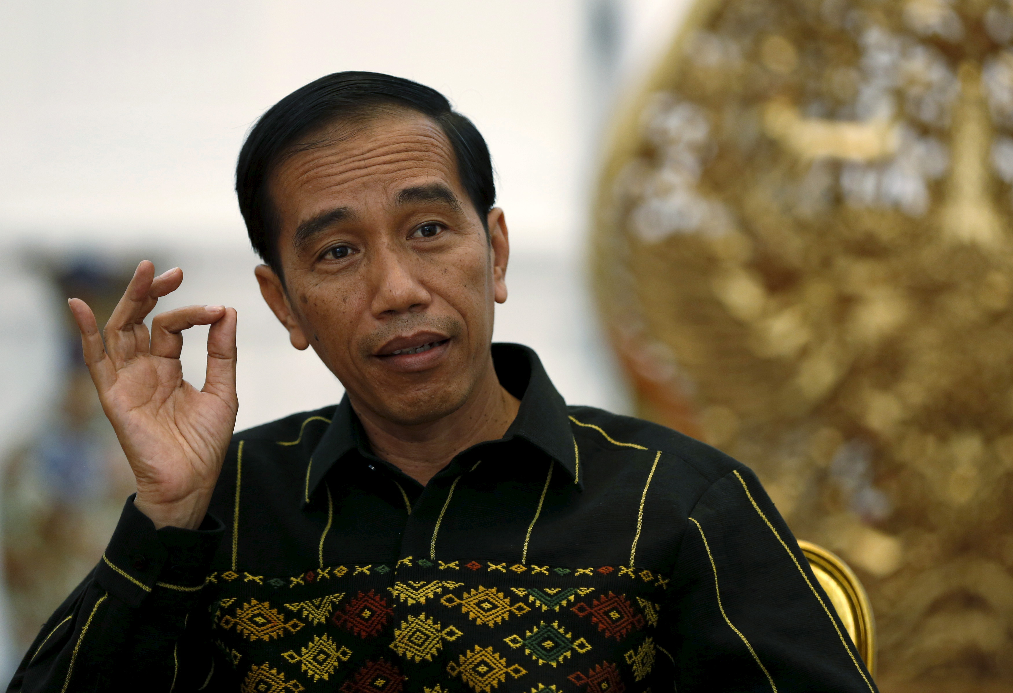 Indonesian President Joko Widodo gestures during an interview with Reuters at the Presidential Palace in Jakarta