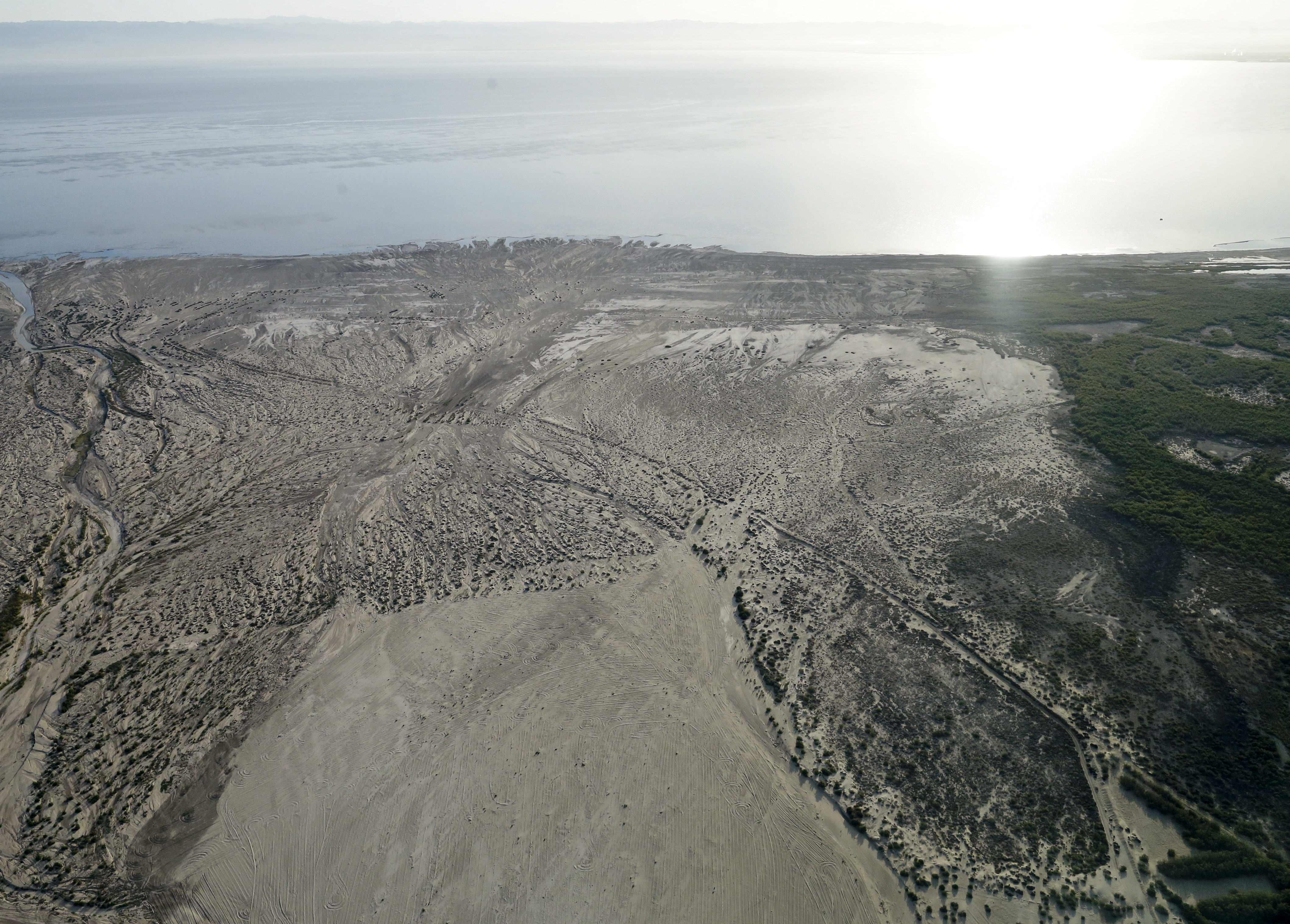 In this May 1, 2015 aerial picture, exposed lakebed of the Salton Sea dries out near Niland, Calif. (Gregory Bull—AP)
