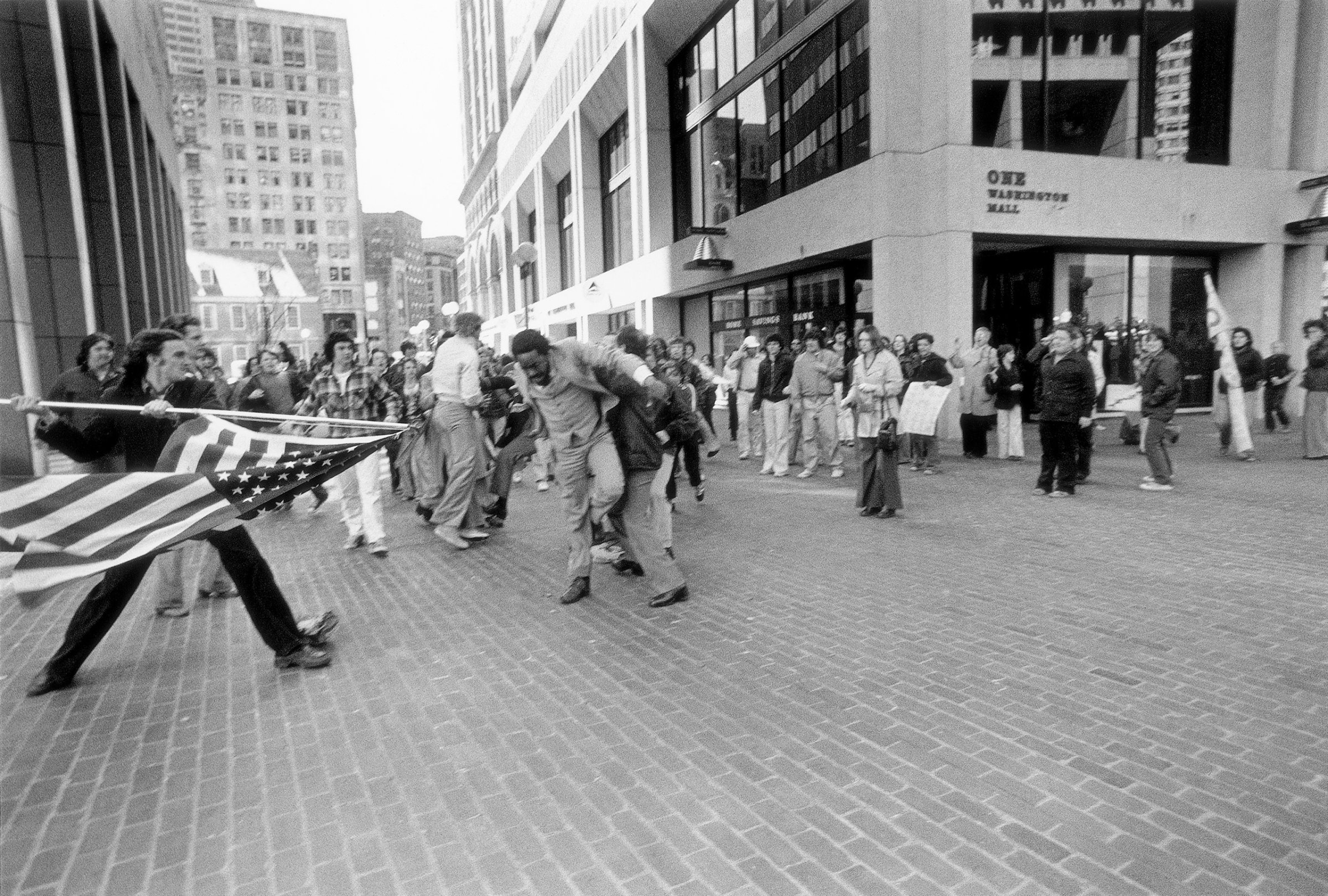 A white teenager, Joseph Rakes, is seen about to assault black lawyer and civil-rights activist Ted Landsmark with a flagpole bearing the American flag in Boston, April 5, 1976.