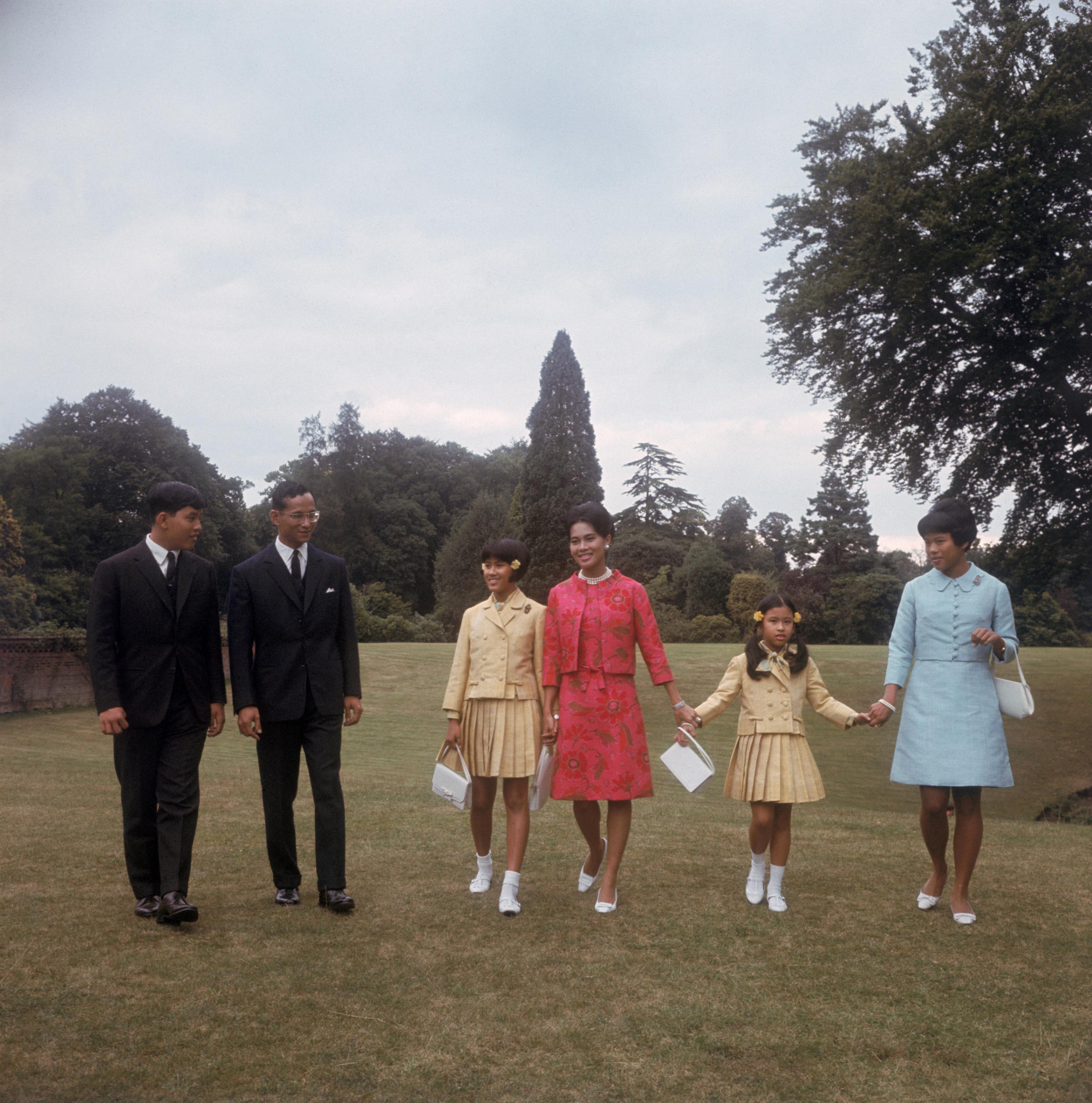 King Bhumibol Adulyadej and Queen Sirikit with their children at King's Beeches, their private residence in Sunninghill, Berkshire, July 27, 1966.