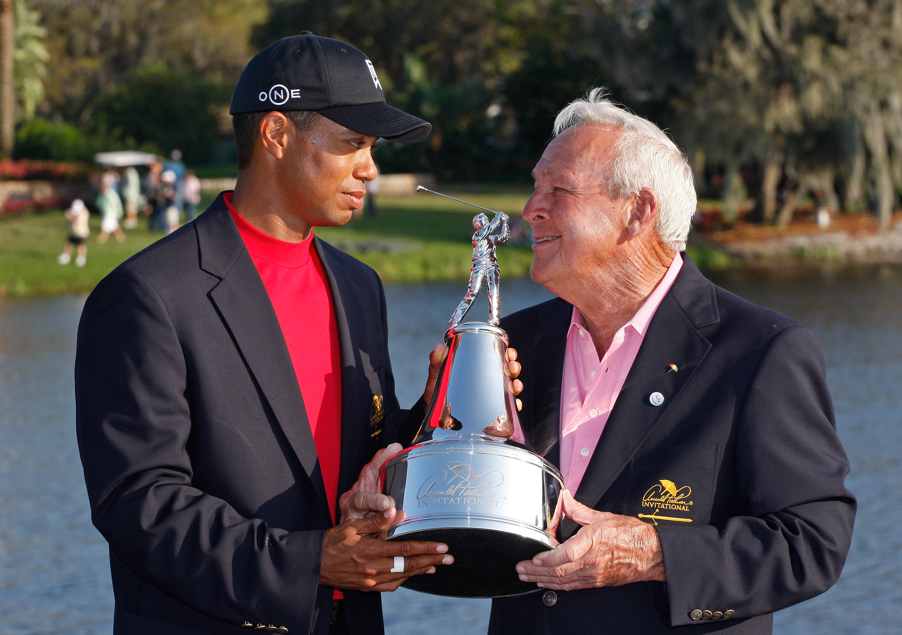 Tiger Woods poses with the winners trophy and Arnold Palmer after his victory in the Arnold Palmer Invitational presented by MasterCard held on March 16, 2008 at Bay Hill Golf Club and Lodge in Orlando, Florida. (Chris Condon&mdash;US PGA TOUR/Getty Images)