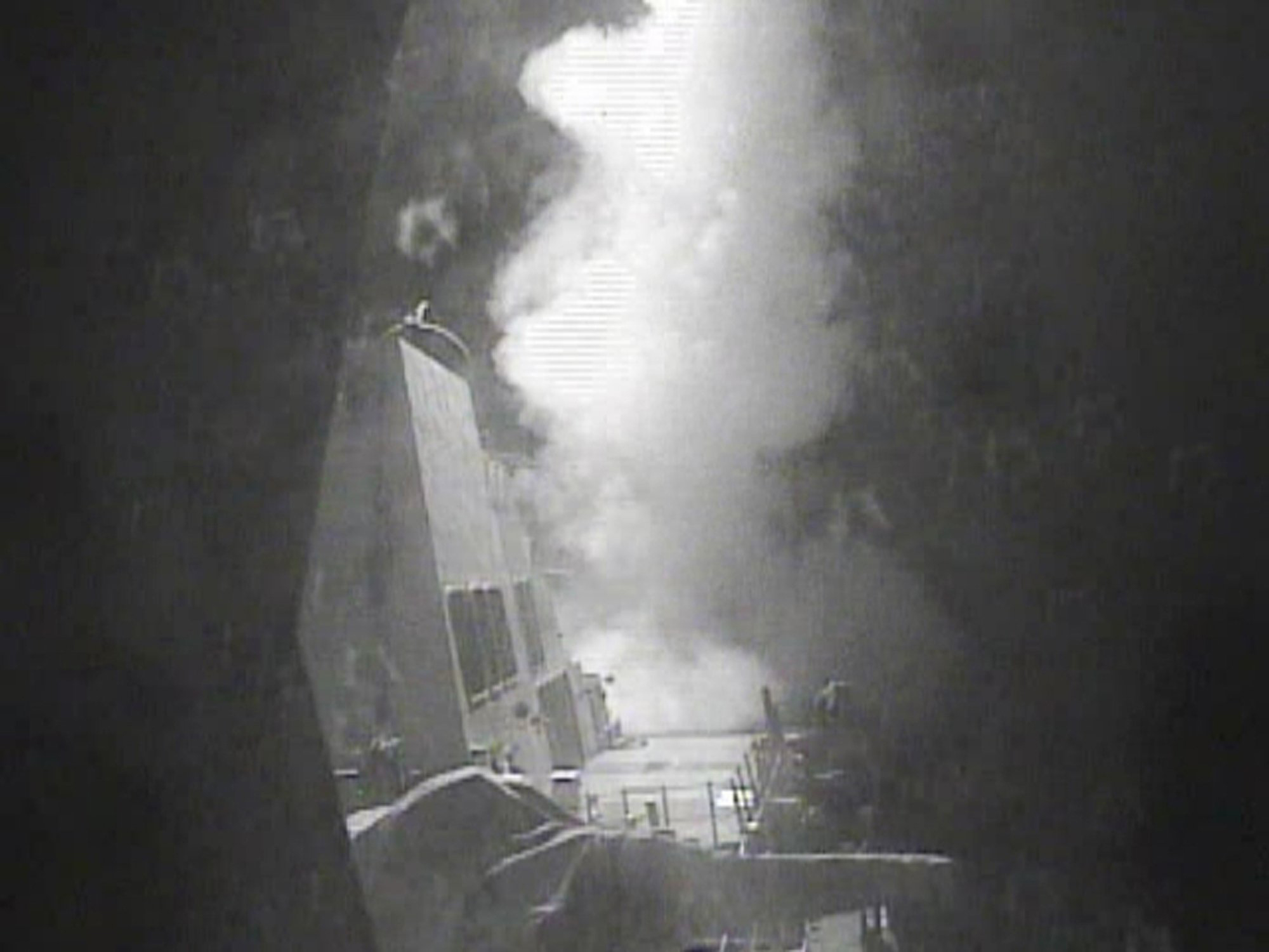 In this Thursday Oct. 13 photo released by U.S. Navy, the guided missile destroyer USS Nitze (DDG 94) launches a strike against coastal sites in Houthi-controlled territory on Yemen's Red Sea coast. U.S.-launched Tomahawk cruise missiles destroyed three coastal radar sites in Houthi-controlled territory on Yemen's Red Sea Coast early Thursday, officials said, a retaliatory action that followed two incidents this week in which missiles were fired at U.S. Navy ships. (U.S. Navy via AP)
