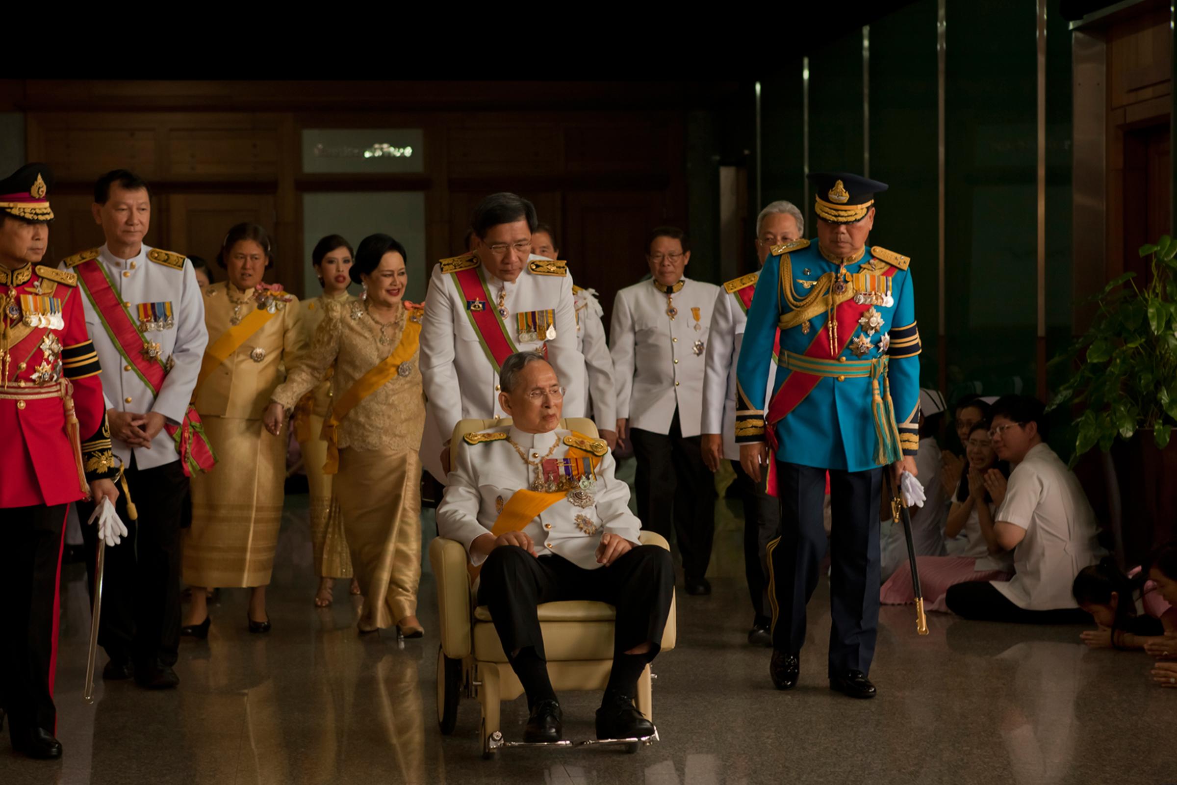 King Bhumibol Adulyadej leaves the Siriraj Hospital for a birthday ceremony at the Grand Palace, Bangkok, Thailand, Dec. 5, 2011.
