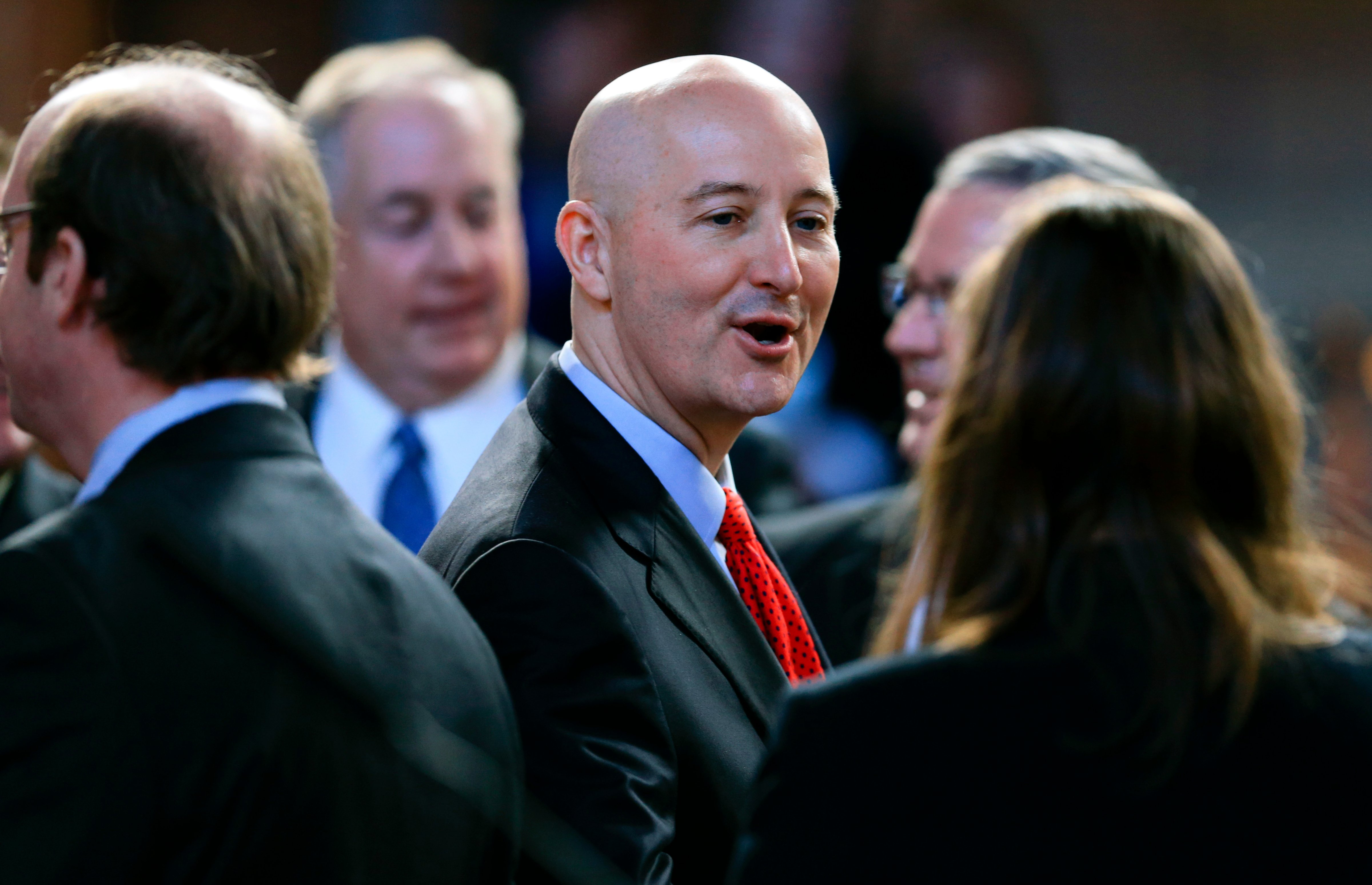 Nebraska Gov. Pete Ricketts greets state senators as he arrives at the Legislative Chamber to deliver the annual State of the State address, in Lincoln, Neb. Jan. 14, 2016. Ricketts led an effort to restore the state's death penalty after lawmakers eliminated it. (Nati Harnik—AP)
