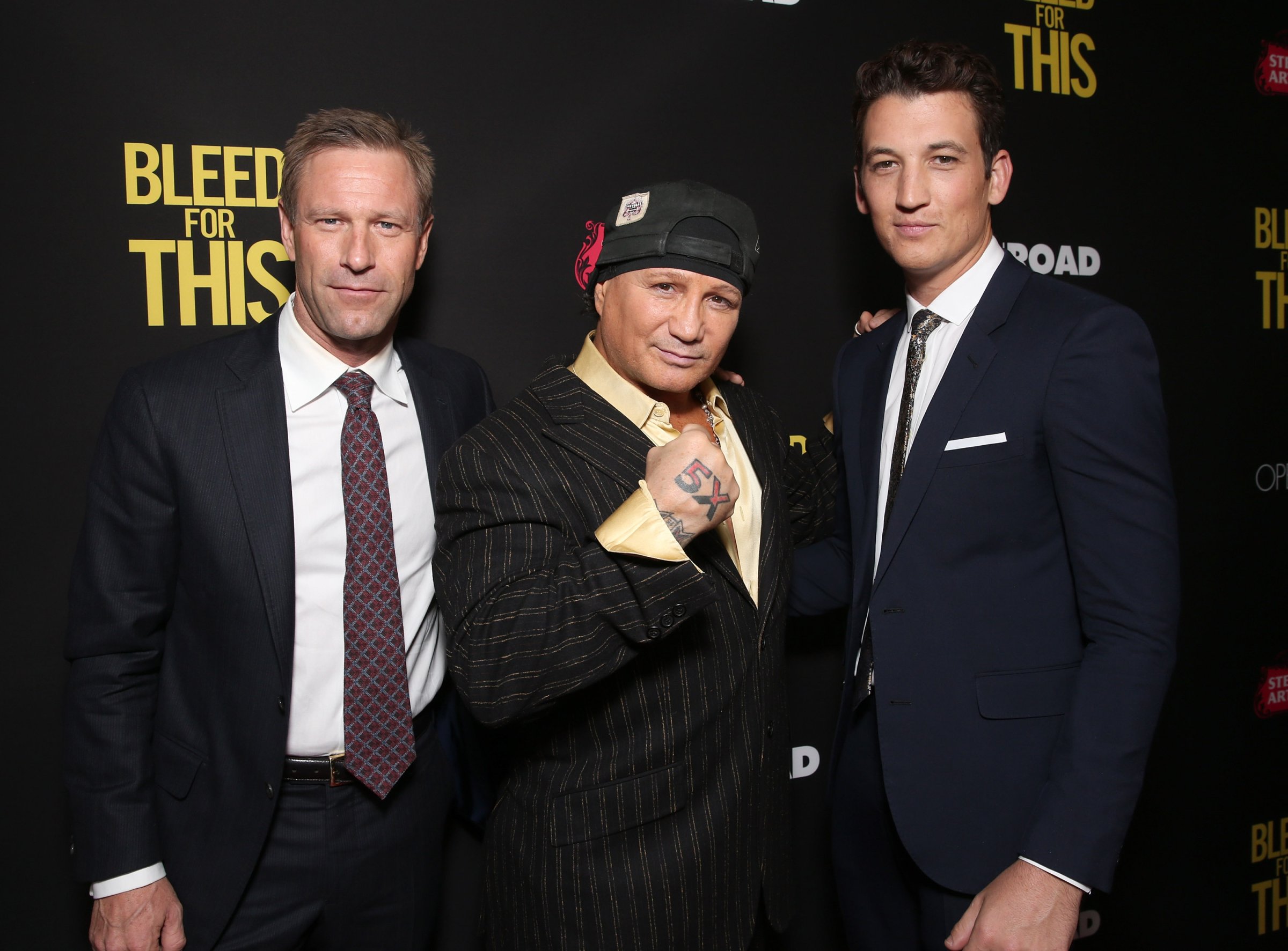 Aaron Eckhart, Vinny Paz and Miles Teller attend the Premiere of "Bleed For This" on November 2, 2016 in Beverly Hills, California.