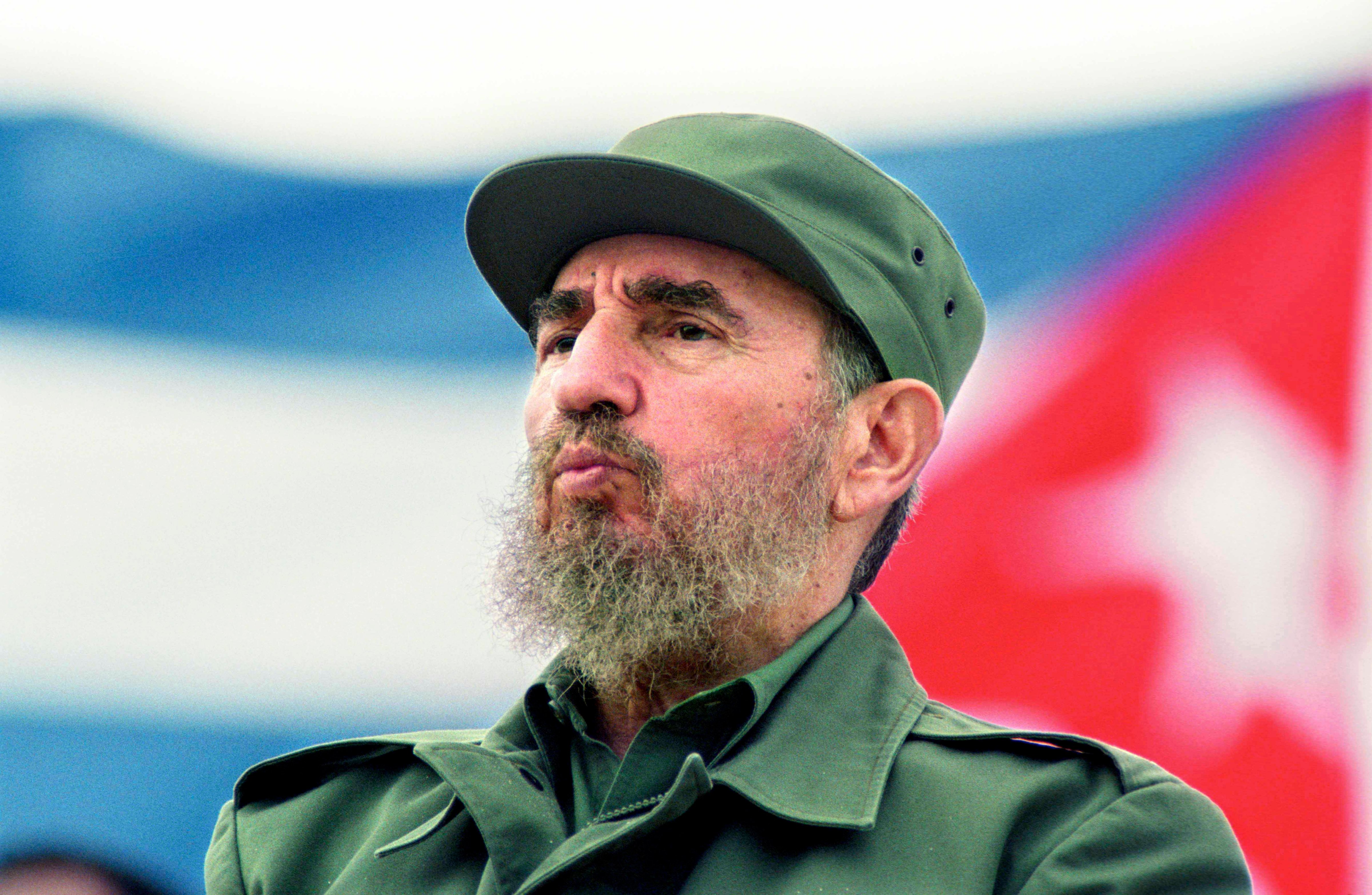 Fidel Castro observes the May Day parade at the Revolution Square in Havana, Cuba May 1, 1998. (Sven Creutzmann/Mambo Photo—Getty Images)