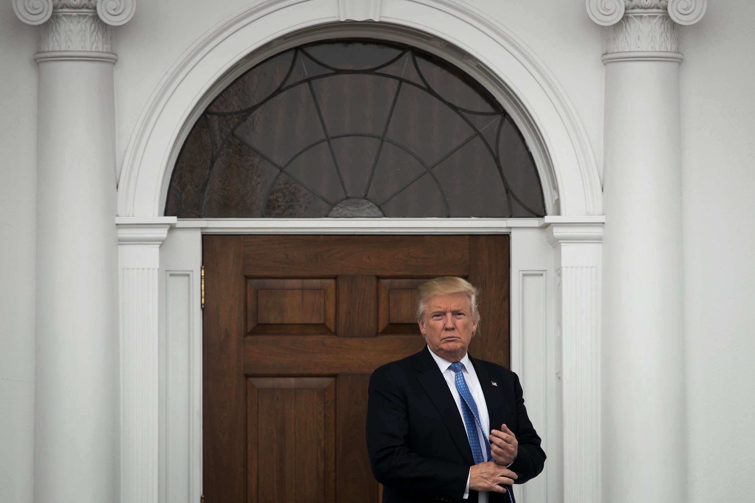 BEDMINSTER TOWNSHIP, NJ - NOVEMBER 20: President-elect Donald Trump stands outside the clubhouse following his meeting with Peter Kirsanow, attorney and member of the U.S. Commission on Civil Rights, at Trump International Golf Club, November 20, 2016 in Bedminster Township, New Jersey. Trump and his transition team are in the process of filling cabinet and other high level positions for the new administration. (Photo by Drew Angerer/Getty Images)