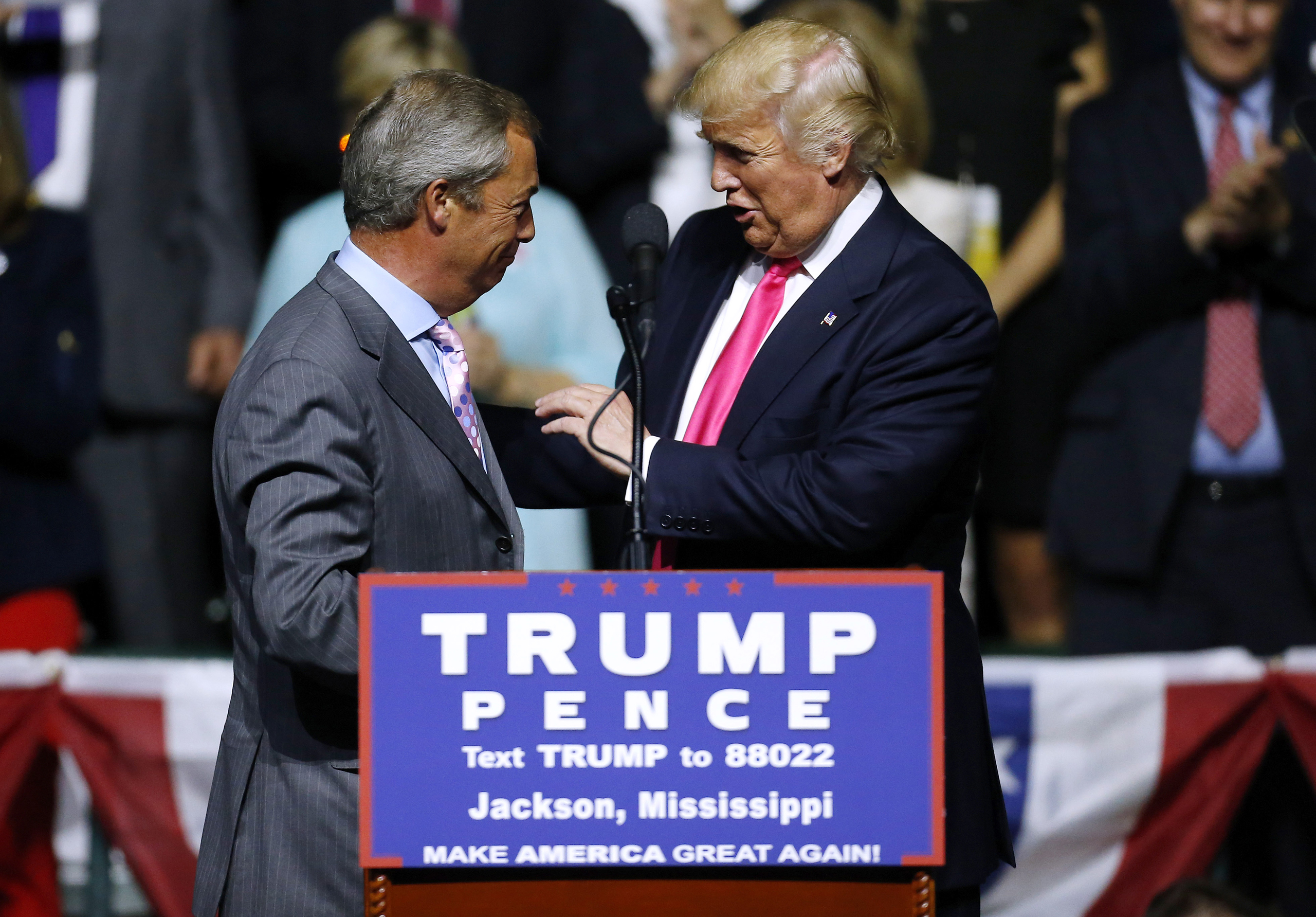 Donald Trump greets United Kingdom Independence Party leader Nigel Farage during a campaign rally at the Mississippi Coliseum on Aug. 24, 2016. (Jonathan Bachman—Getty Images)