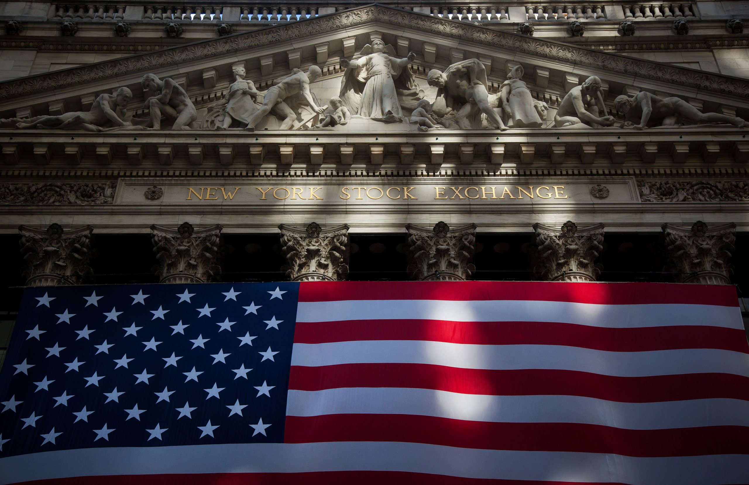 An American flag is displayed at the New York Stock Exchange (NYSE) in New York, U.S., on Nov. 11, 2016. (Michael Nagle—Bloomberg/Getty Images)