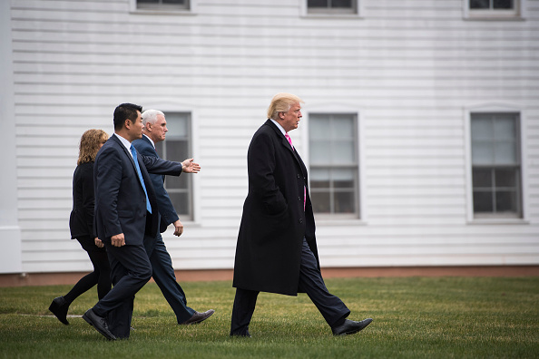 President-elect Donald Trump and Vice President-elect Mike Pence walk out from Lamington Presbyterian Church after attending services in Bedminster Township, N.J. on Sunday, Nov. 20, 2016.