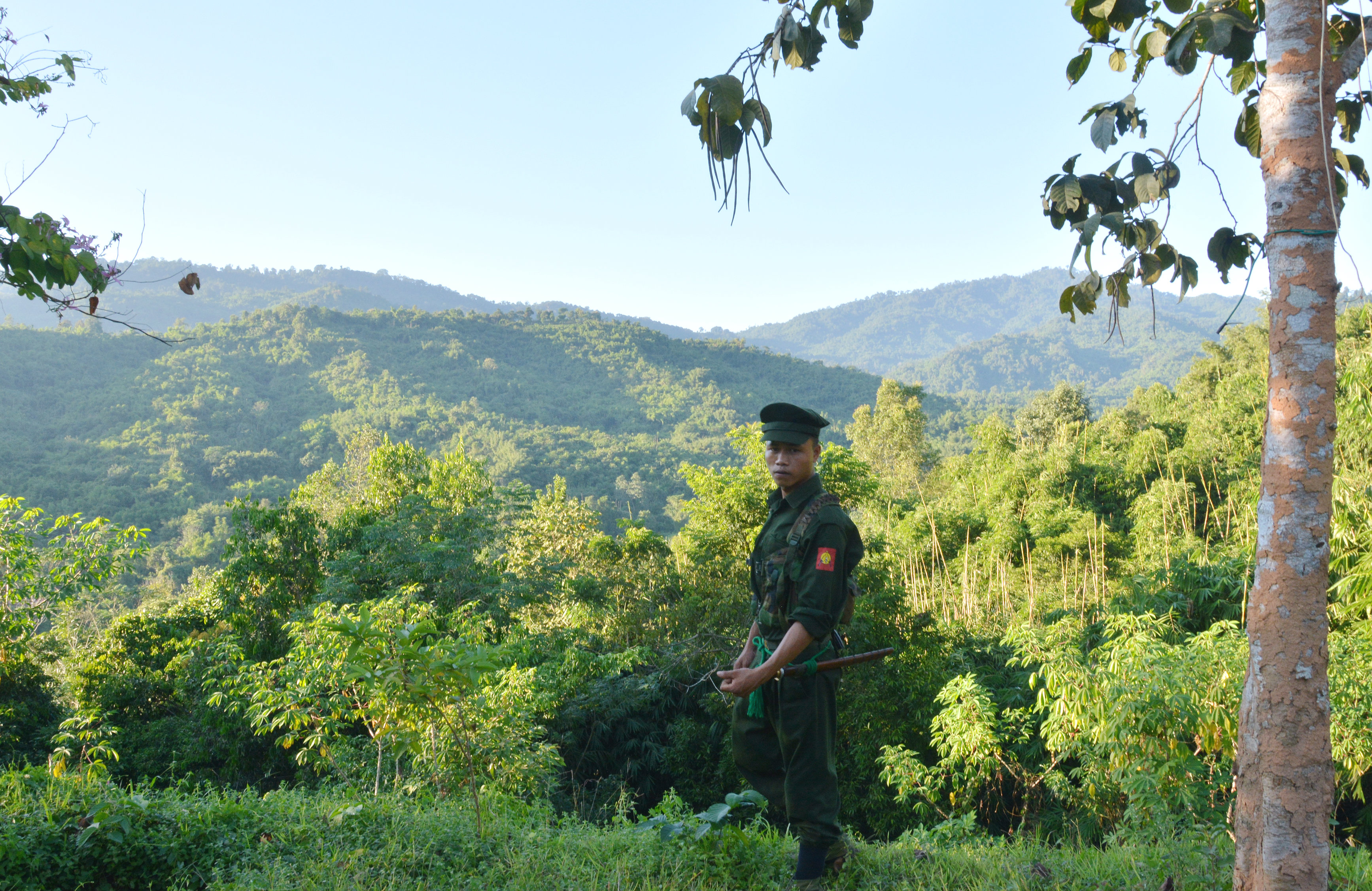A Kachin Independence Army (KIA) soldier seen at Lawa Yang front-line post. The Burma army is stationed on the hills in the background. (Paul Vrieze)