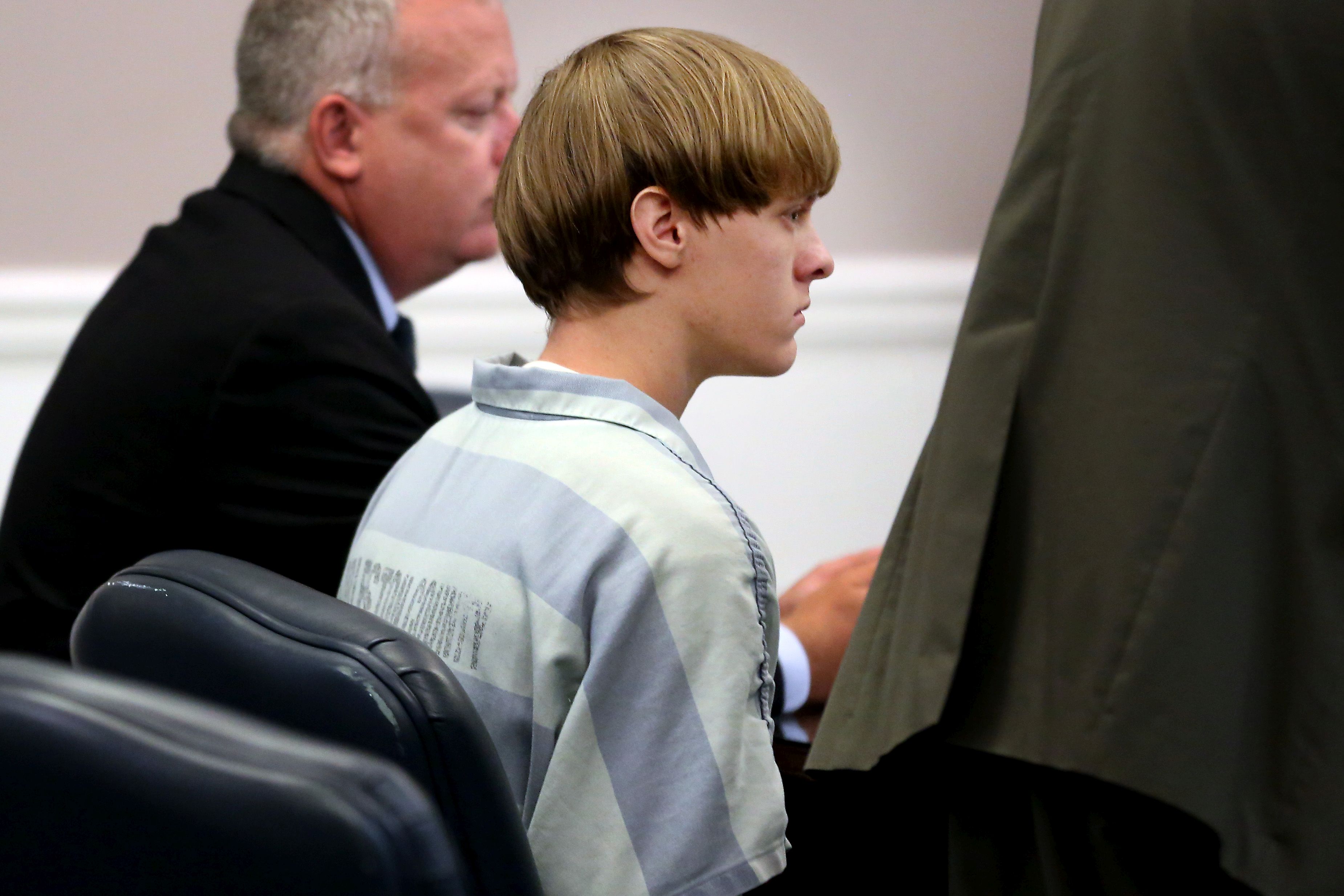Dylan Roof (C), the suspect in the mass shooting that left nine dead in a Charleston church appears in court in Charleston, S.C., on July 18, 2015.