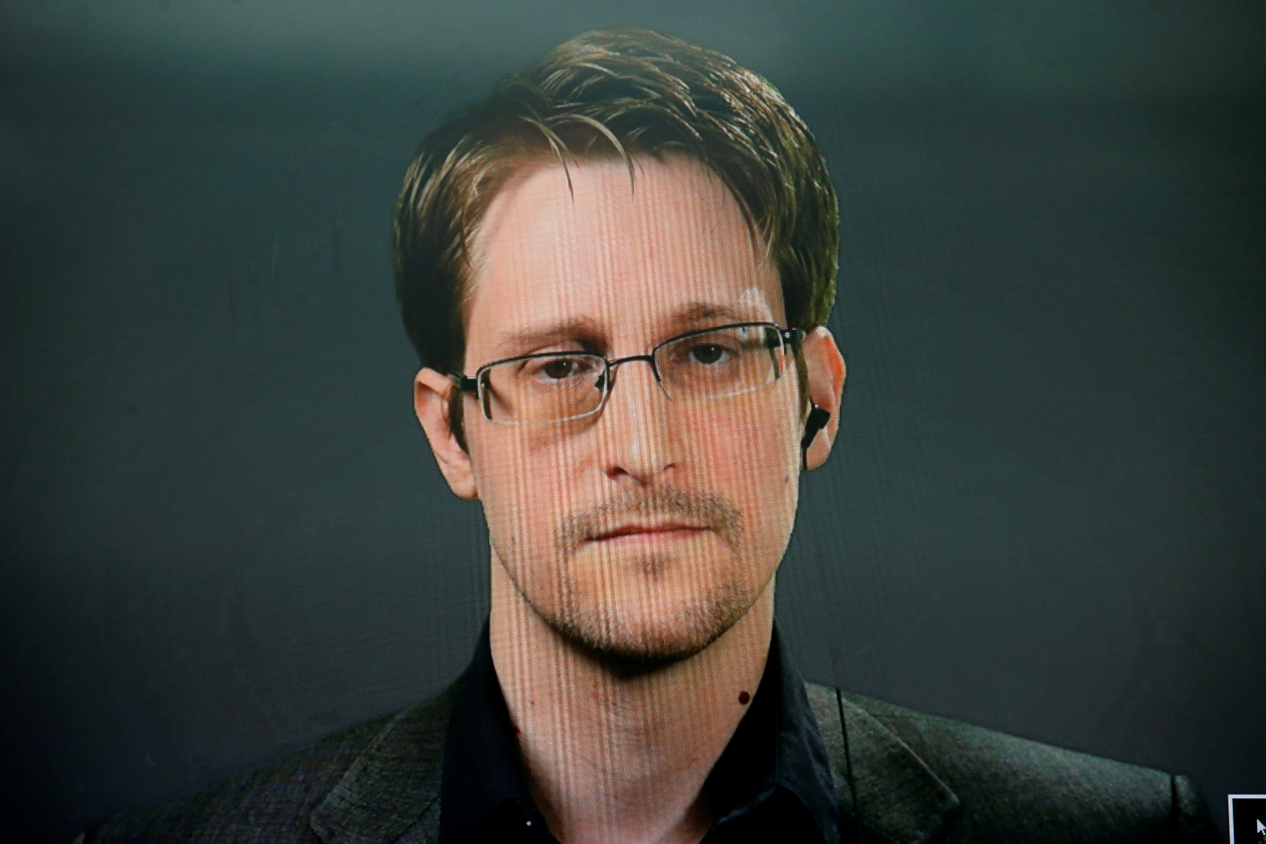 Edward Snowden speaks via video link during a news conference in New York