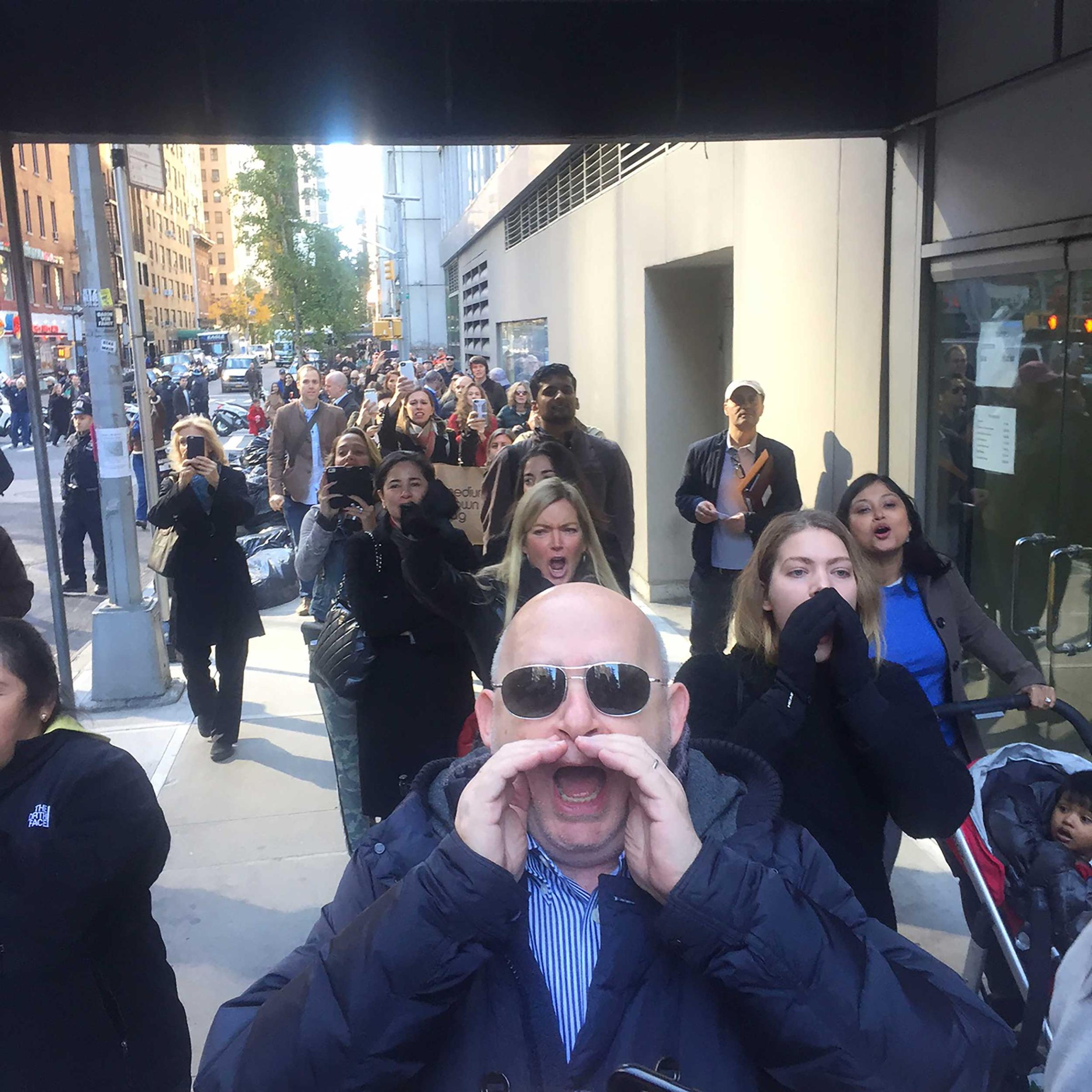 USA. NYC. November 8th, 2016.  Residents wait two to three hours to vote at the PS59 polling station on 56th Street. Voters heckle Donald Trump as he enters to vote.