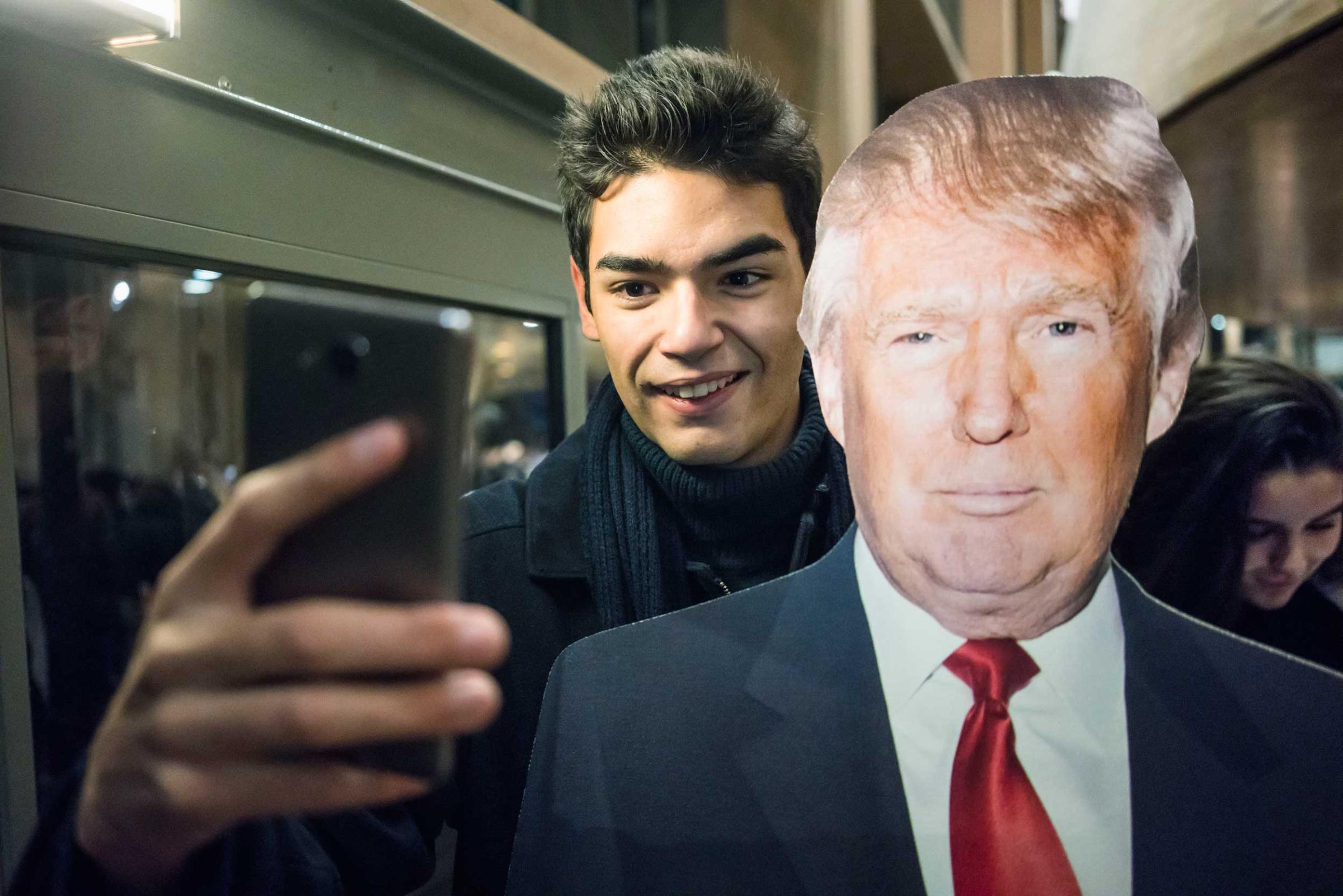 France. Paris.  Following the American elections at the Carré du Temple. Posing for a selfie with Trump. 2016