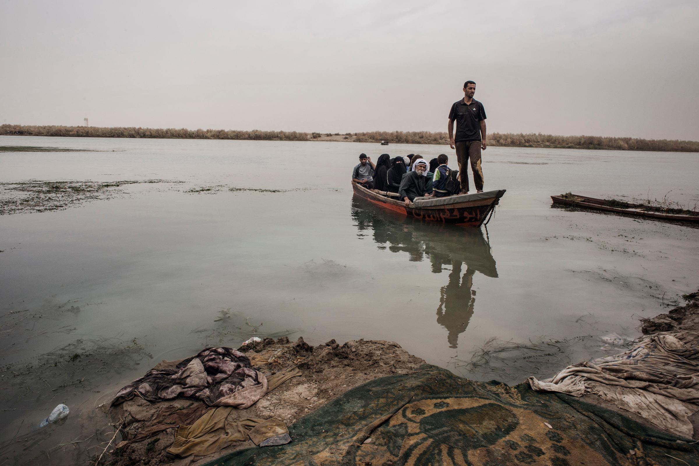 Families cross the Tigris River in northern Iraq to escape from ISIS during the Mosul offensive. Many others went by car, truck or on foot.