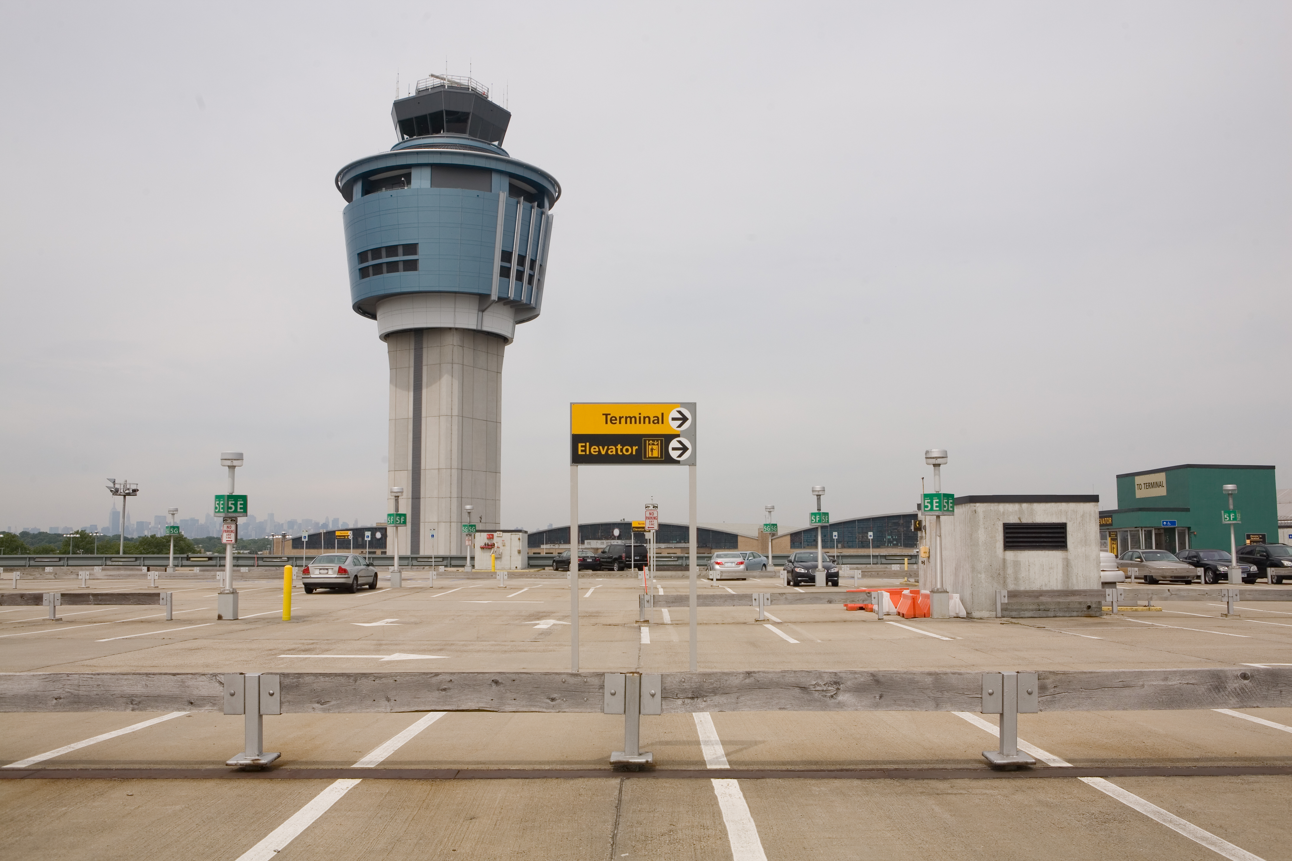 Parking lot and air traffic control tower at LaGuardia Airport, New York City (Skyhobo—Getty Images/iStockphoto)
