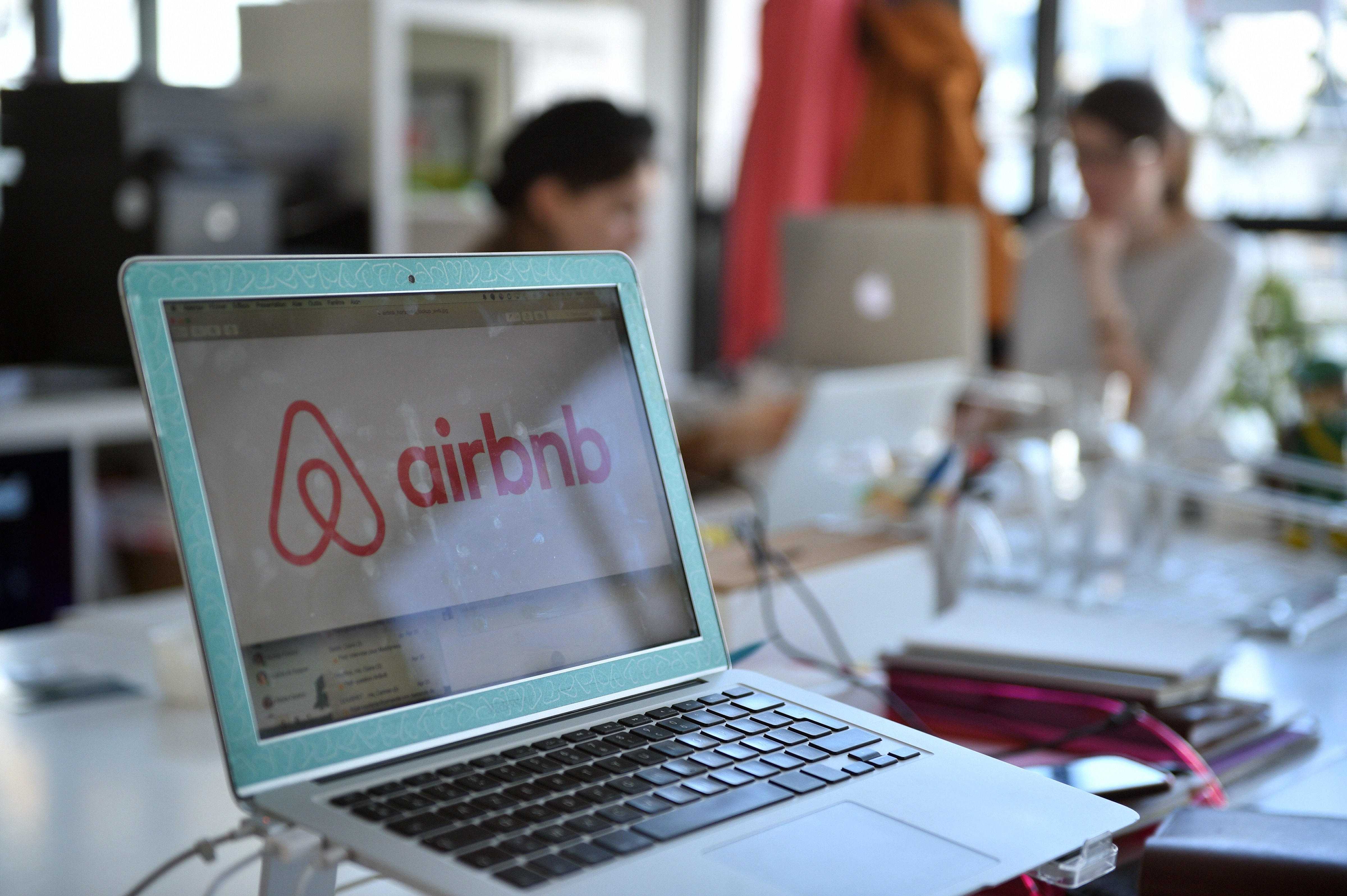 A picture shows the logo of online lodging service Airbnb displayed on a computer screen in the Airbnb offices in Paris on April 21, 2015. (Martin Bureau—AFP/Getty Images)