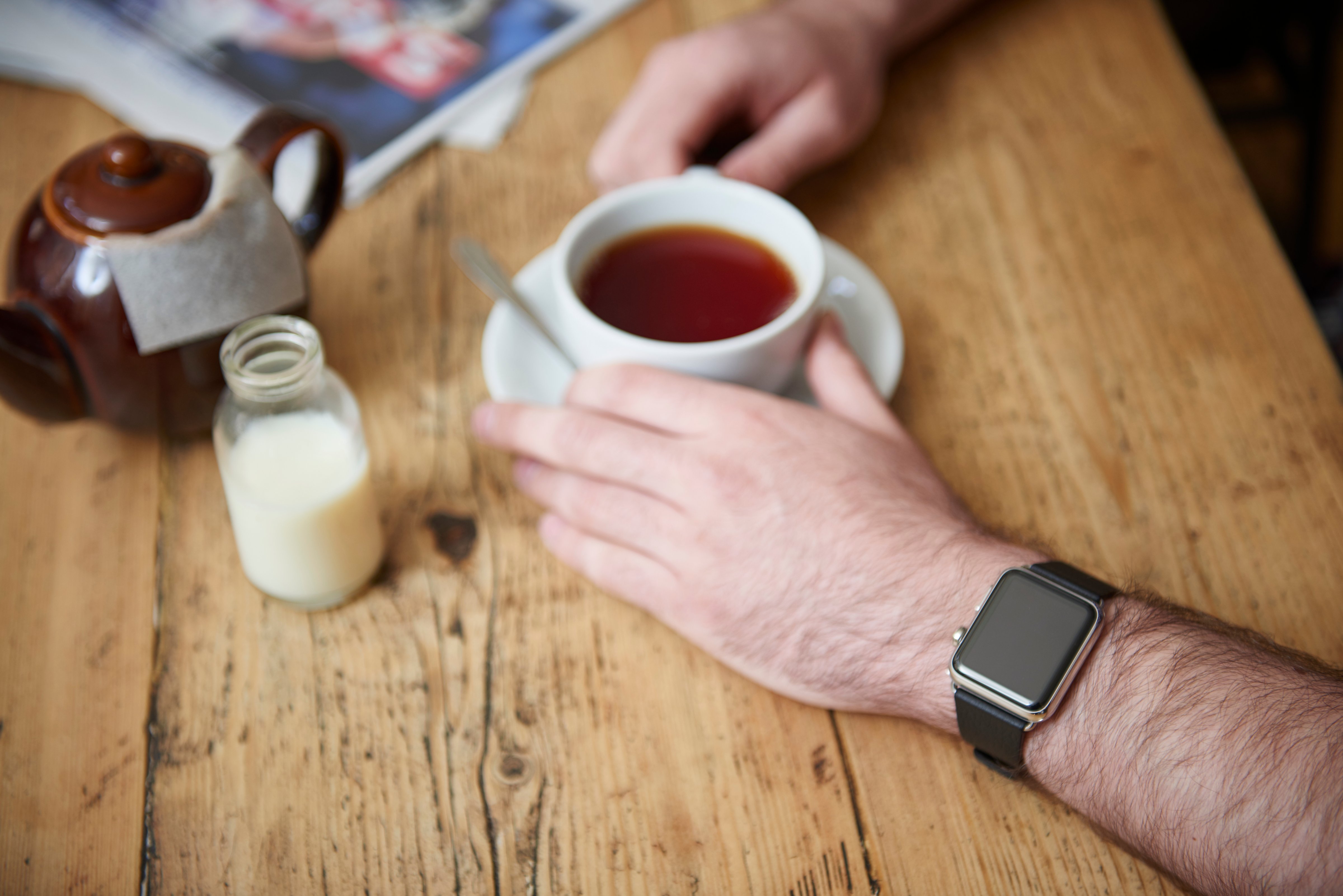 Detail of a man wearing an Apple Watch while sitting inside a cafe, taken on May 21, 2015. (Photo by Joseph Branston/Future Publishing via Getty Images) (Future Publishing&mdash;Future Publishing)