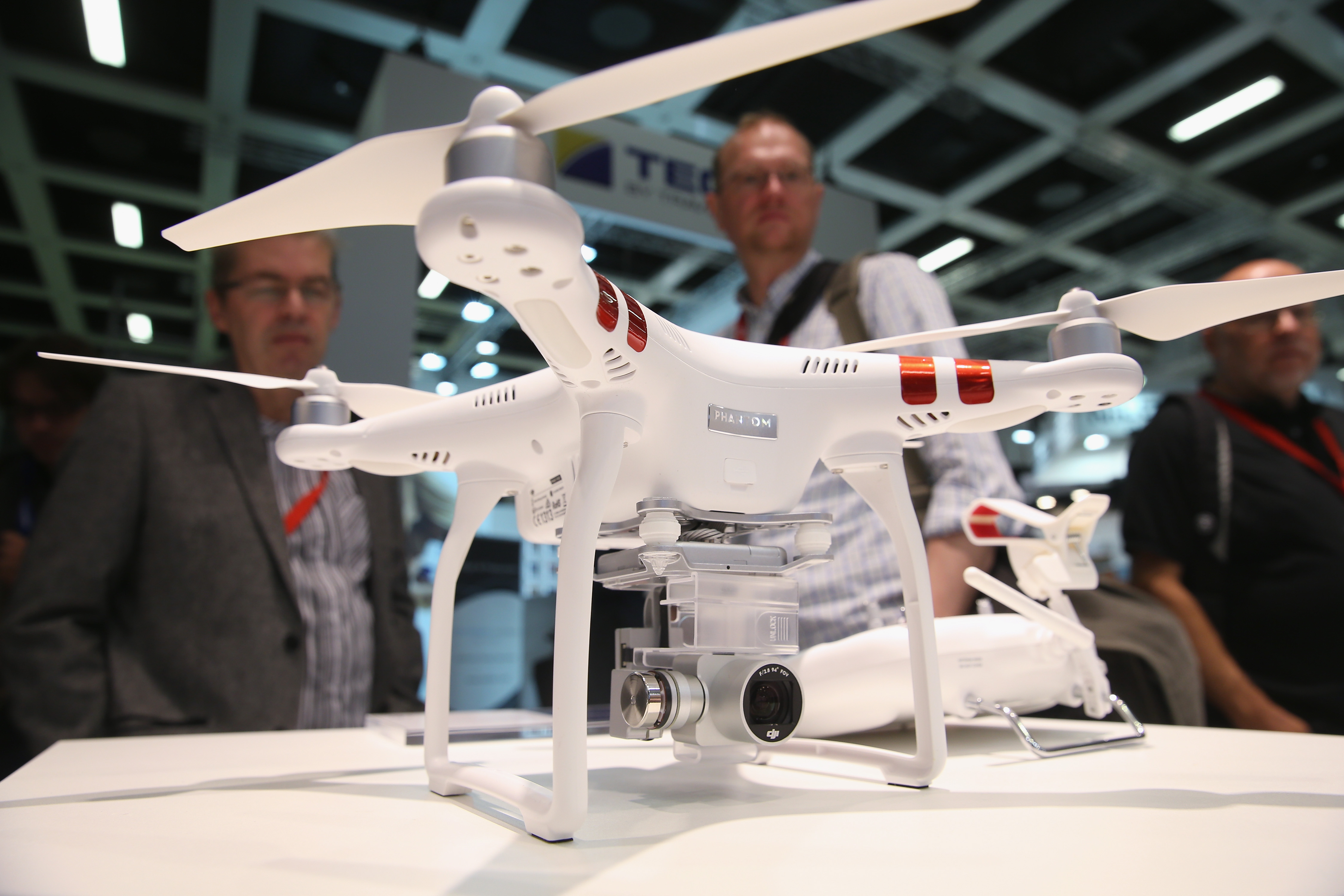 Visitors look at a Phantom 3 Standard quadcopter drone at the DJI stand during a press day at the 2015 IFA consumer electronics and appliances trade fair on September 3, 2015 in Berlin, Germany. (Sean Gallup&mdash;Getty Images)
