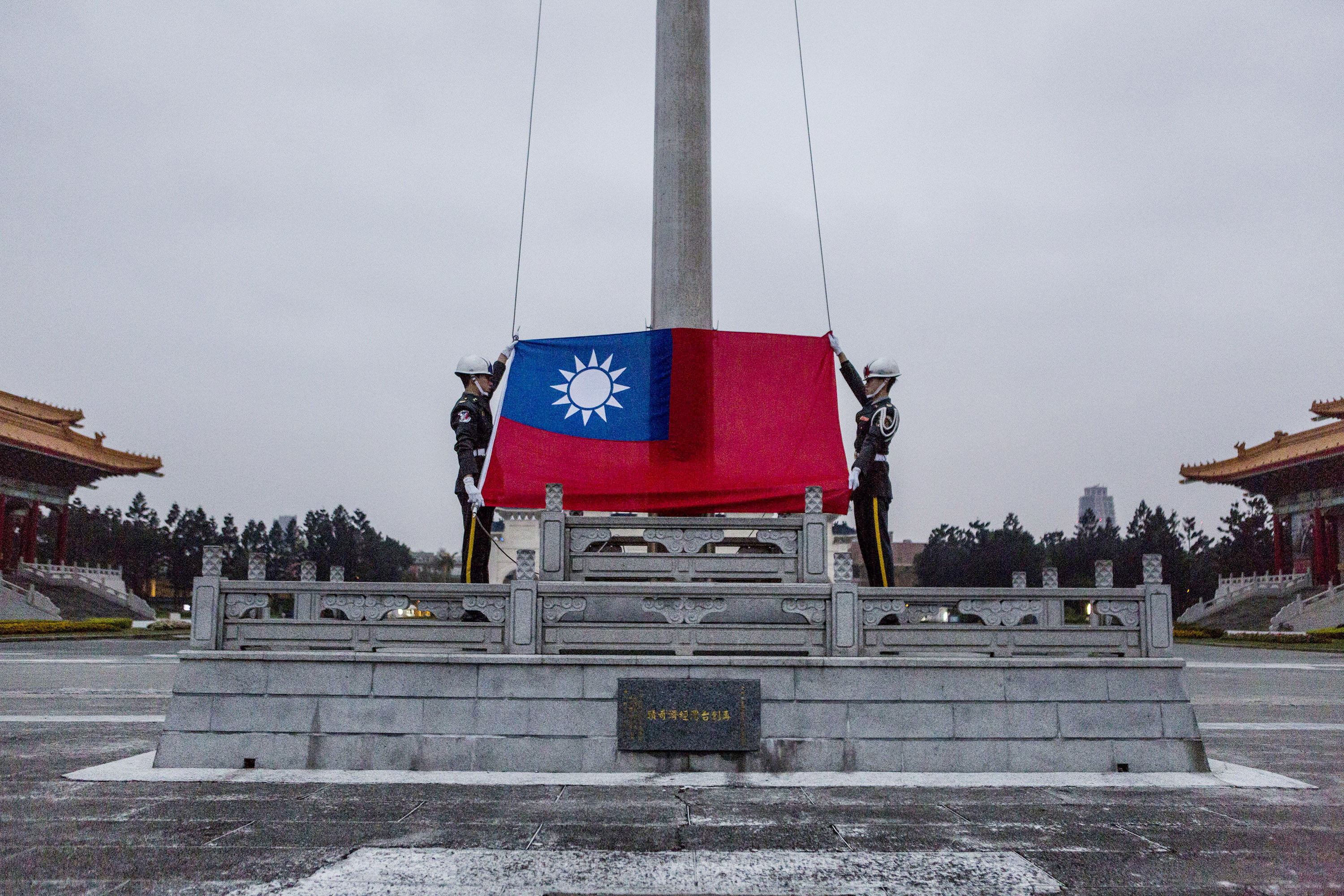 Honor guards prepare to raise the Taiwan flag in the Chiang Kai-shek Memorial Hall Square in Taipei on Jan. 14, 2016, ahead of the Taiwanese presidential election (Ulet Ifansasti—Getty Images)