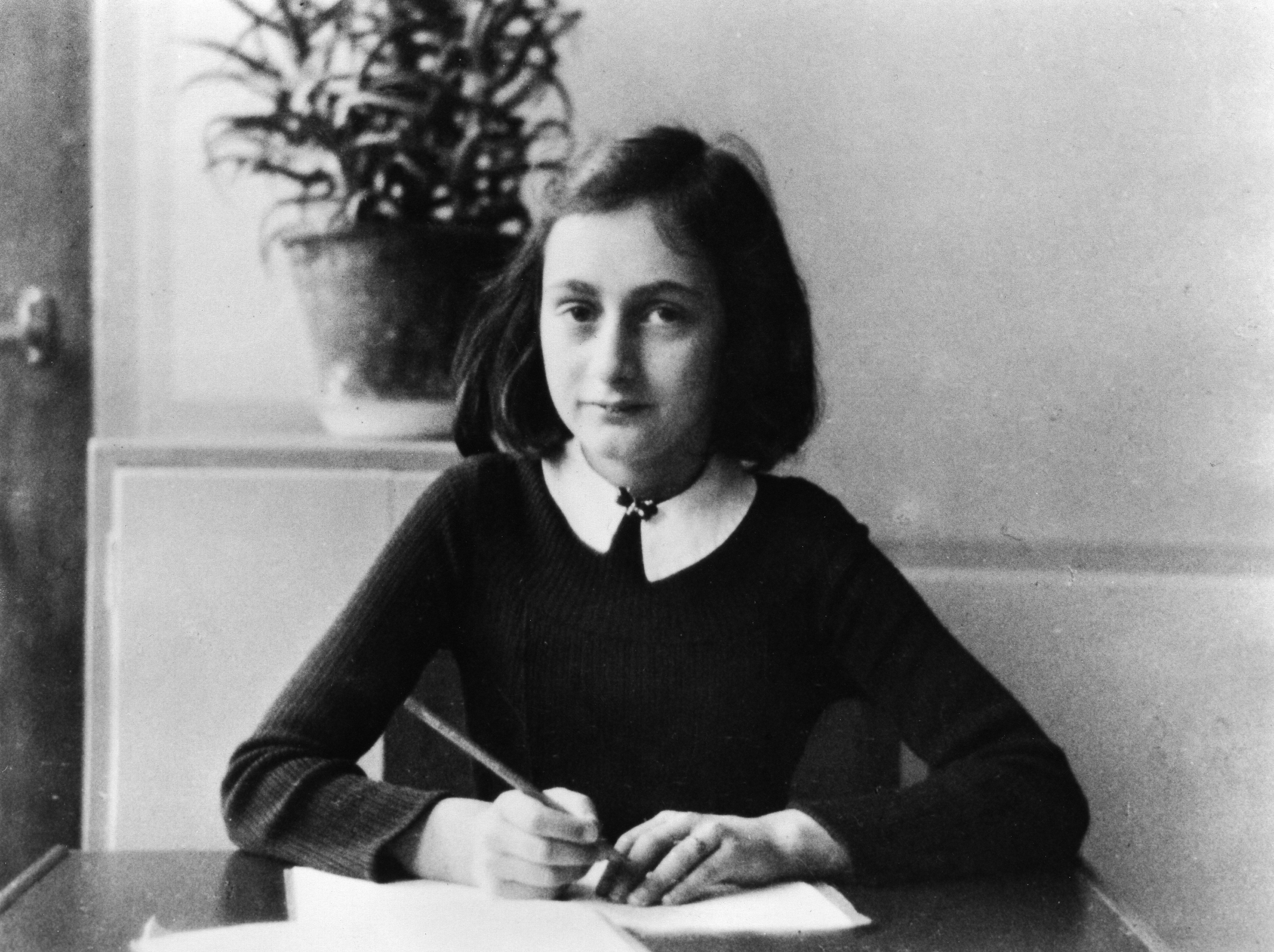 Anne Frank, German Jew who emigrated with her family to the Netherlands during the Nazi era. Separated from the rest of her family, she and her sister died of typhoid fever in the concentration camp Bergen-Belsen - As a 12-year old doing her homewo
