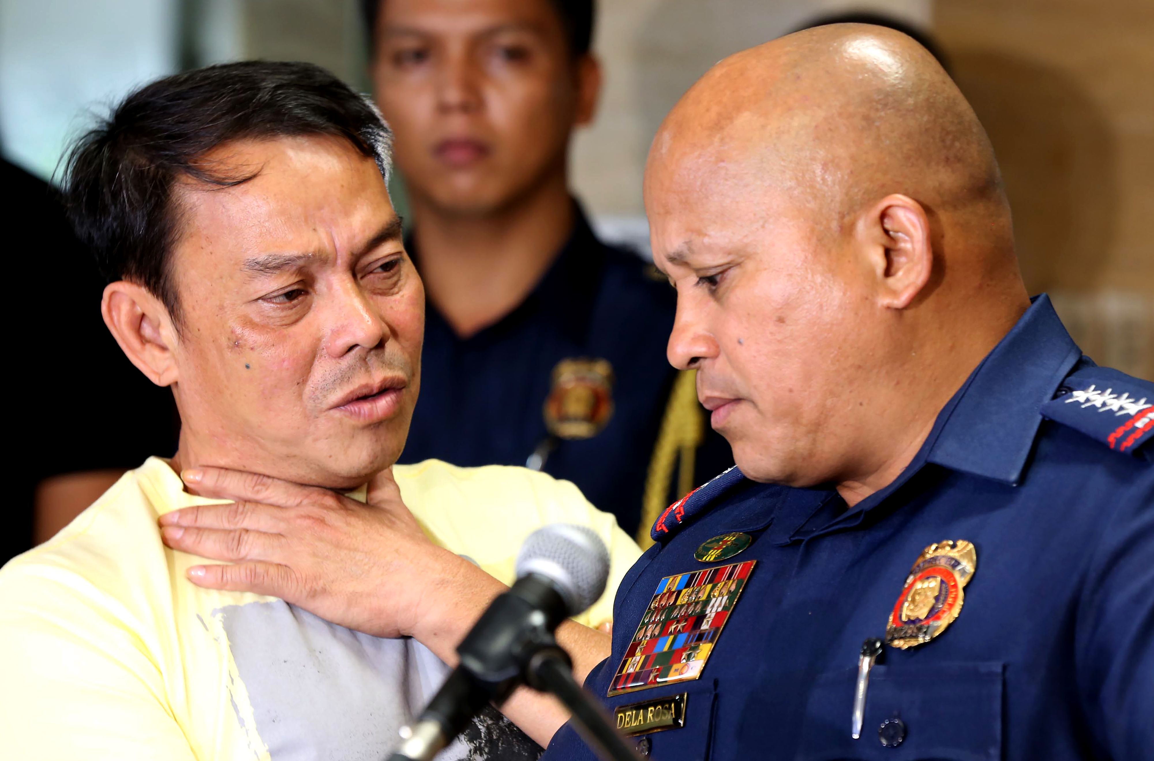 IN a photo taken on Aug. 2, 2016, Albuera Mayor Ronaldo Espinosa, left, talking to Philippine National Police chief Ronald dela Rosa at Camp Crame in Manila (Stringer—AFP/Getty Images)