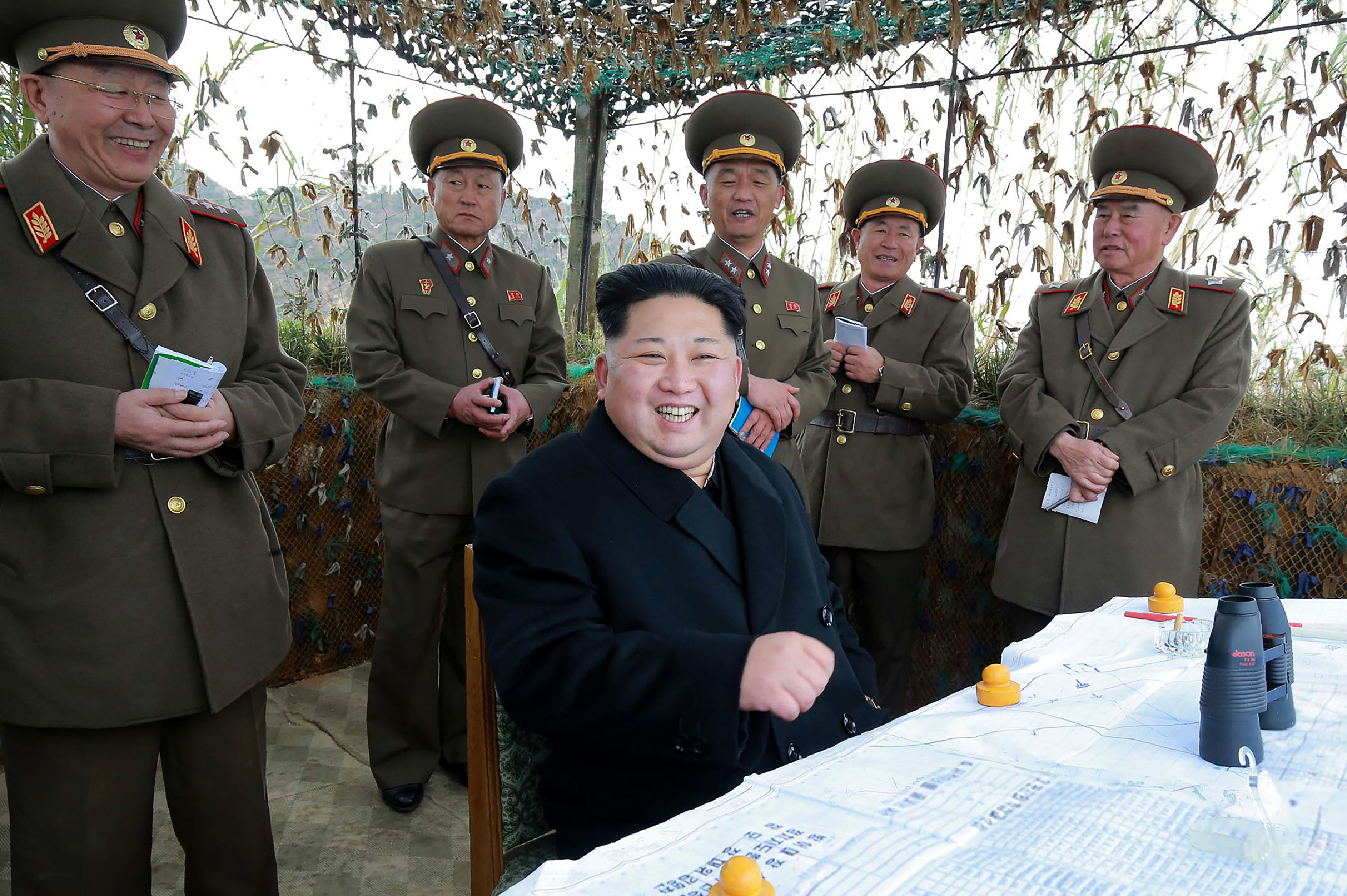 This undated photo released by North Korea's official Korean Central News Agency (KCNA) on November 11, 2016 shows North Korean leader Kim Jong-Un (C) at the defence detachment on Mahap Islet in Ongjin County, South Hwanghae.  China has reportedly banned a nickname that refers to the North Korean leader from its main search engine and social media sites. (KNS—AFP/Getty Images)