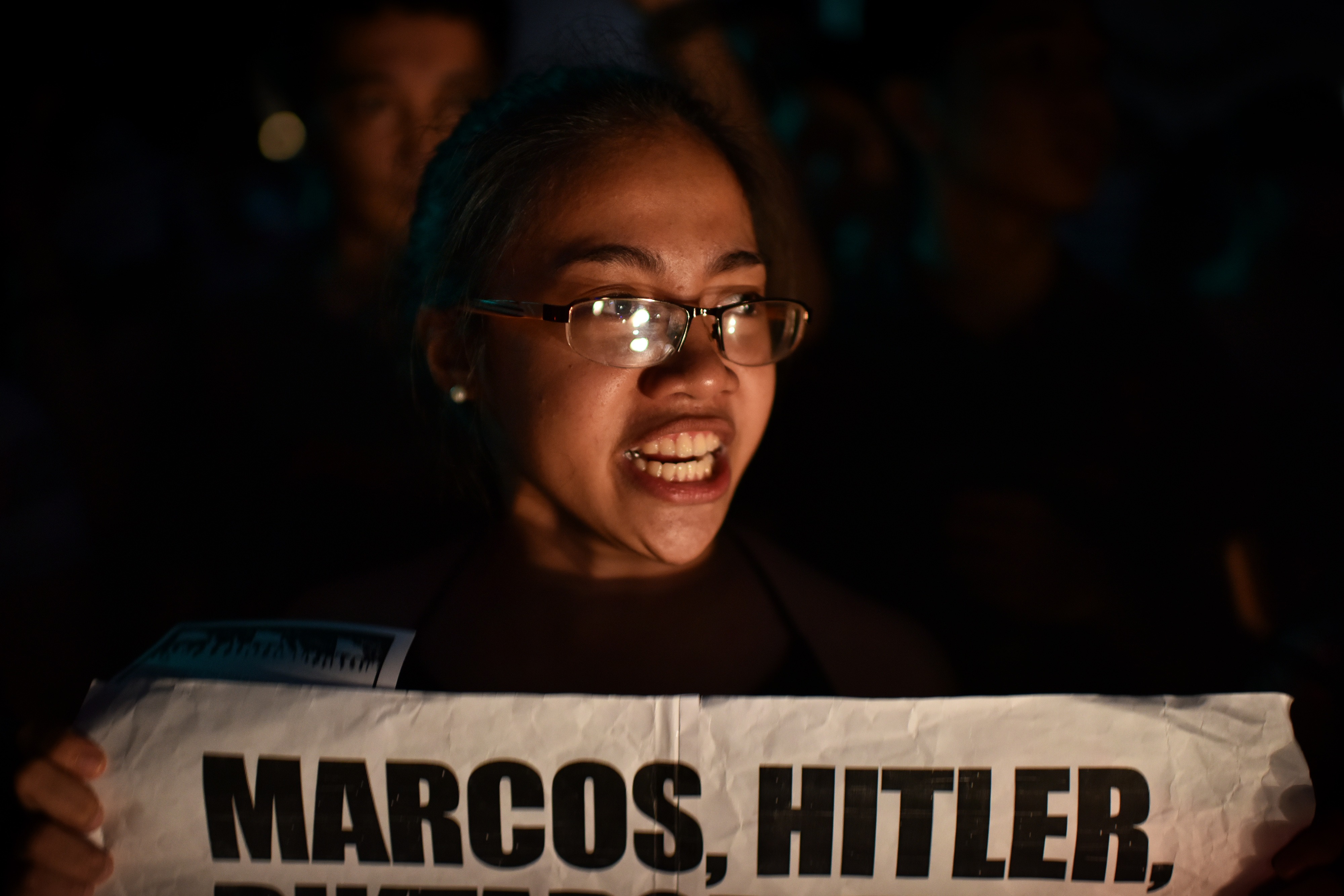Students and anti-Marcos activists take to the streets of Manila to protest the hero's burial accorded to former Philippine dictator Ferdinand Marcos on Nov. 18, 2016. (Jes Aznar—Getty Images)